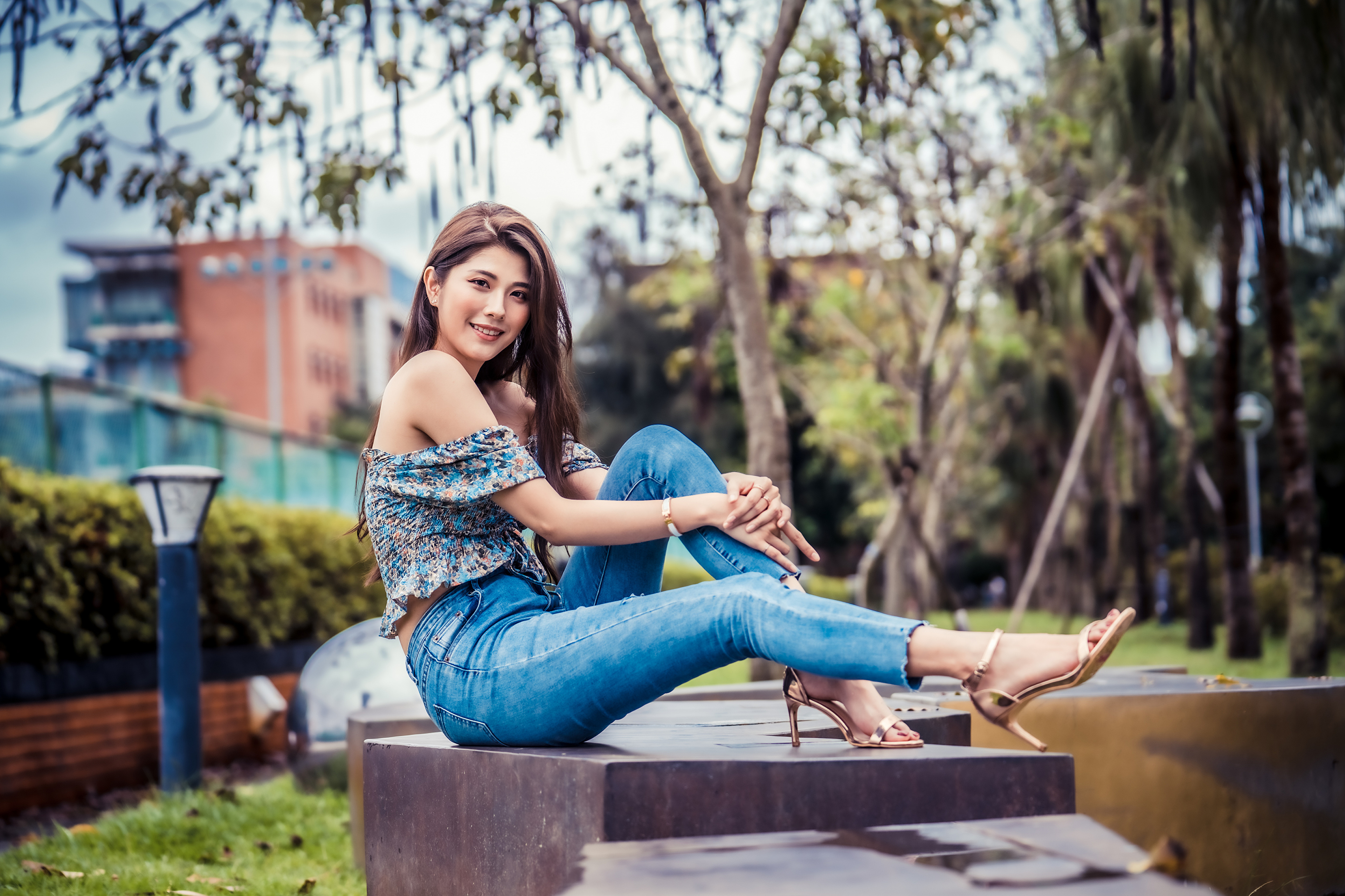 People 3840x2559 Asian model women long hair brunette depth of field sitting jeans barefoot white high heels bench trees building street light fence bushes bare shoulders blouses women outdoors heels golden heels urban outdoors looking at viewer