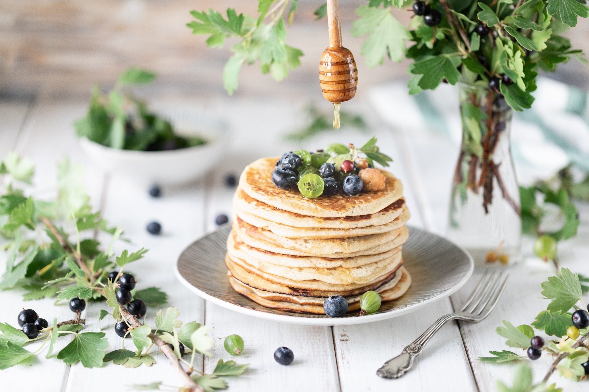 General 1920x1280 food berries fruit pancakes honey blueberries fork leaves wooden surface dripping vibrant