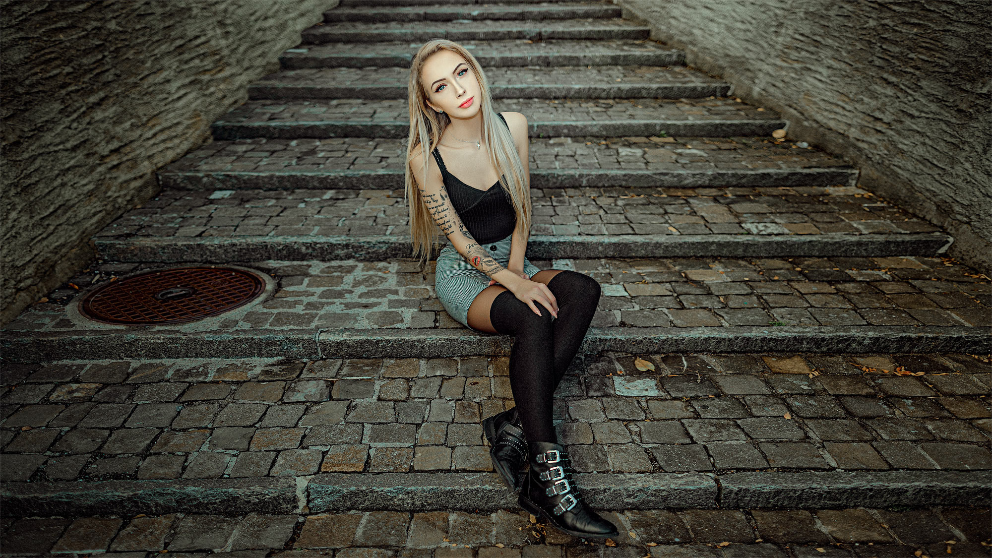 People 2000x1125 women sitting blonde portrait shoes skirt stairs tattoo black stockings blue eyes necklace long hair stockings thigh-highs
