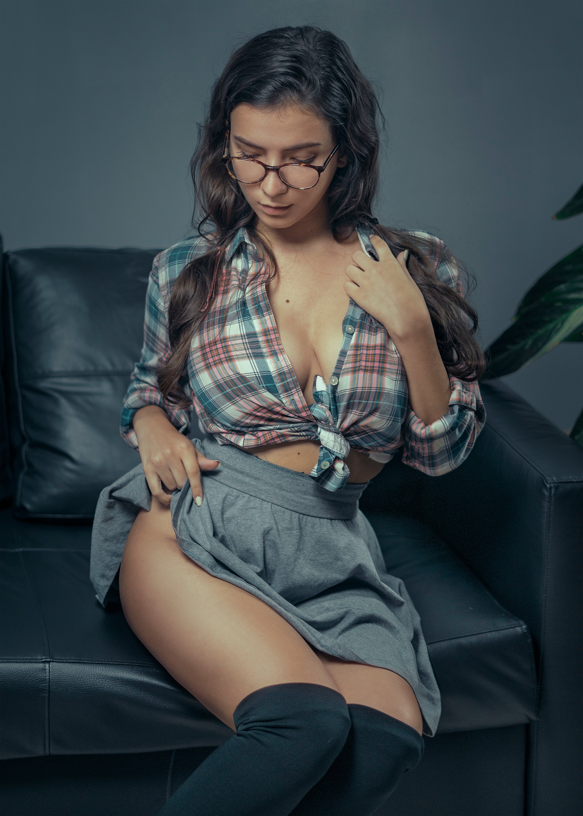 People 2000x2800 Catarina Antunes women model brunette long hair glasses shirt plaid shirt checkered plaid plaid clothing skirt grey skirt sitting thighs thick eyebrows couch lifting skirt pulling clothing knee-highs moles twintails Igor Makovsky looking at viewer no bra tied top cleavage women indoors portrait display