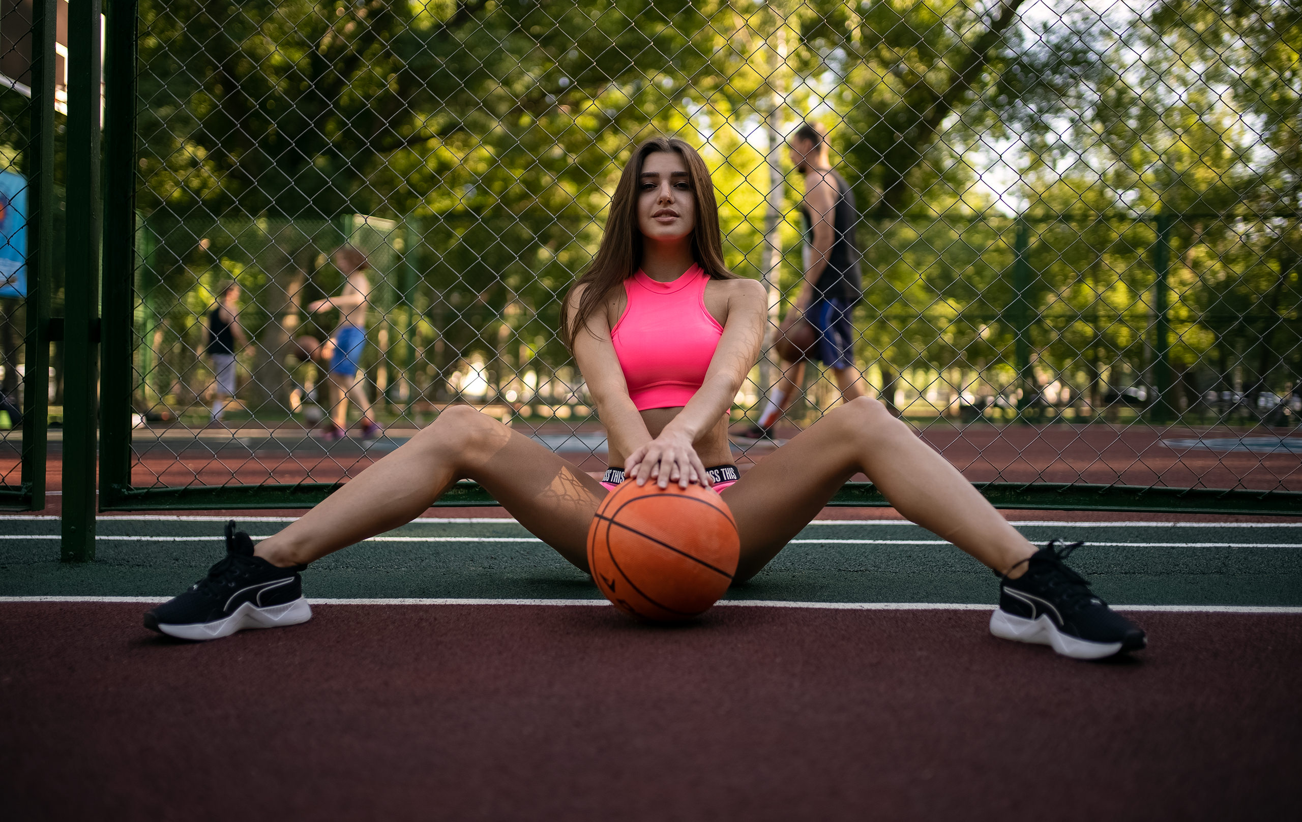 People 2560x1617 women basketball court ball sportswear brunette women outdoors spread legs sneakers sitting strategic covering trees smiling frontal view Alina Naumenko