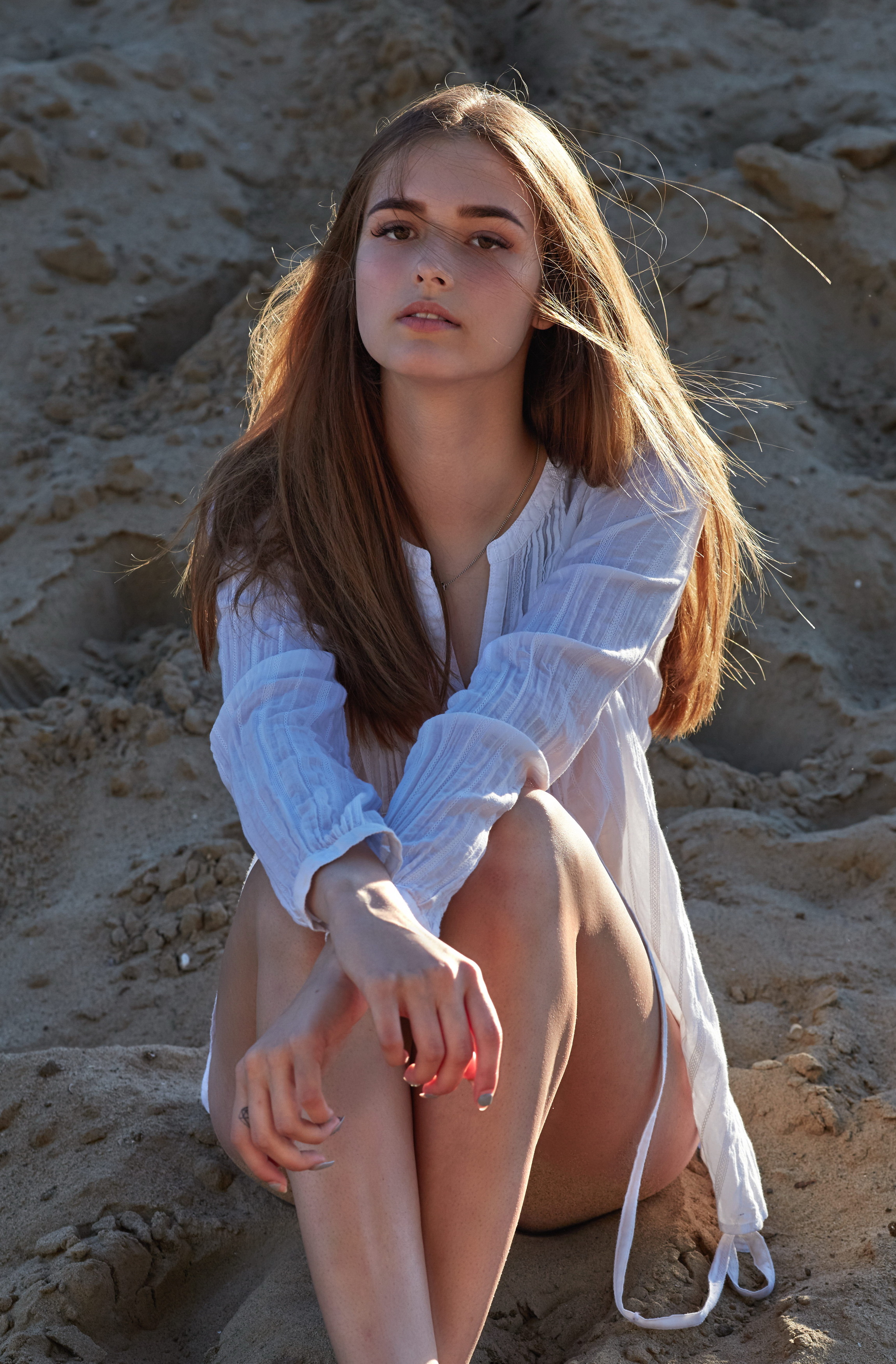 People 2300x3500 women model blonde long hair face women outdoors portrait display sitting sand white clothing long nails windy