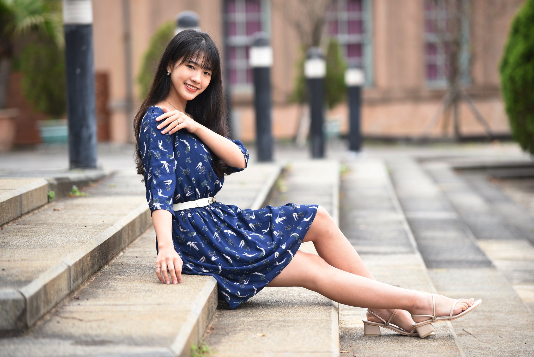 People 2048x1367 Asian women sitting depth of field barefoot sandal earring belt plants bushes brunette stairs poles blue dress model smiling looking at viewer long hair blurred blurry background