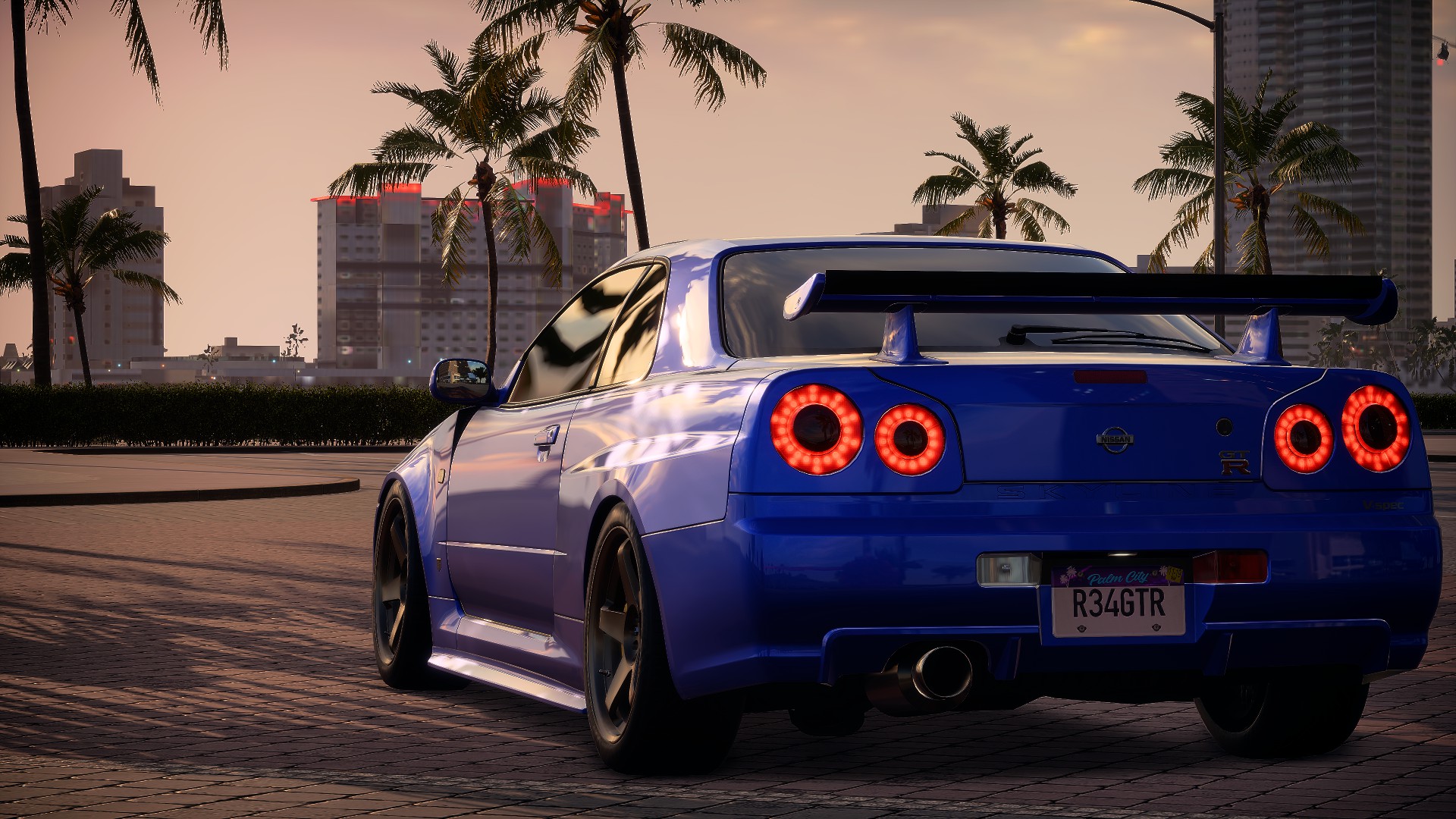 General 1920x1080 Nissan Skyline GT-R V-Spec Nissan Skyline R34 old car Need for Speed: Heat Nissan street view city rear view Japanese cars car car spoiler video games Electronic Arts