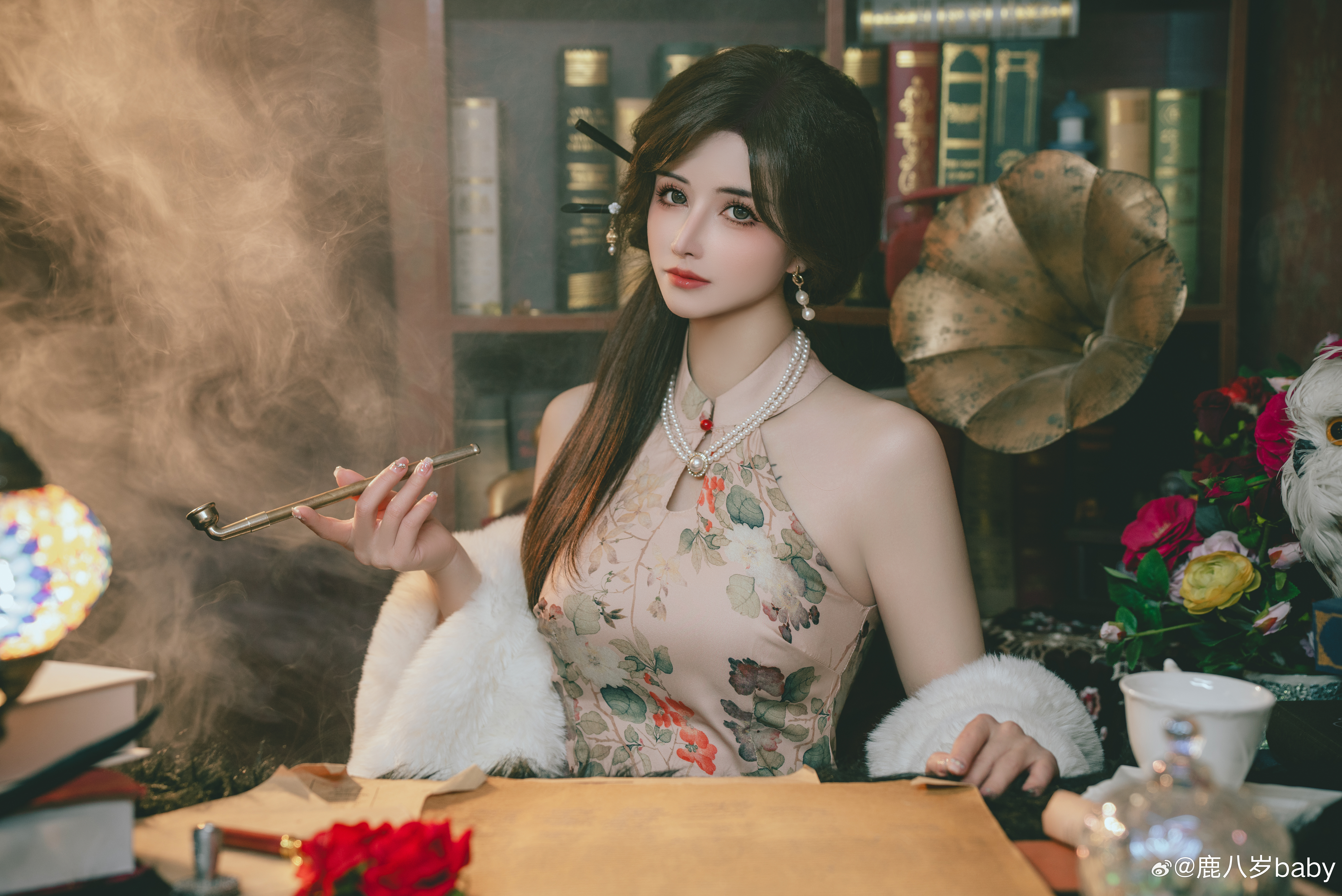 People 8480x5664 cosplay women Asian Lulubaby looking at viewer sitting bare shoulders rose watermarked Weibo closed mouth long hair fur smoking pipe smoke pearl necklace indoors women indoors necklace shelves books earring dress dark hair lip gloss leaves
