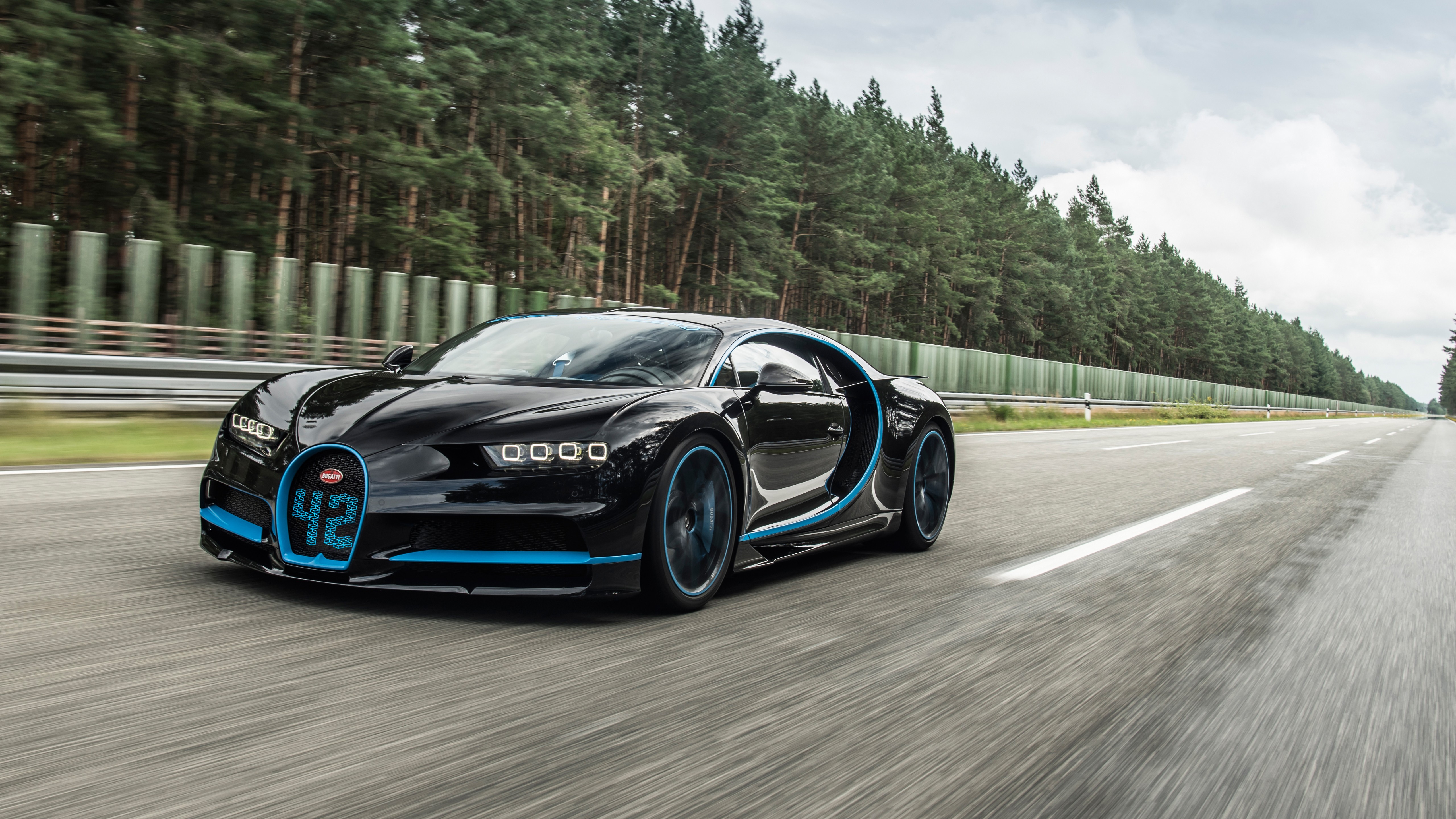 General 5120x2880 car Bugatti Chiron tracks Bugatti French Cars Volkswagen Group black cars Hypercar frontal view headlights trees driving sky clouds road