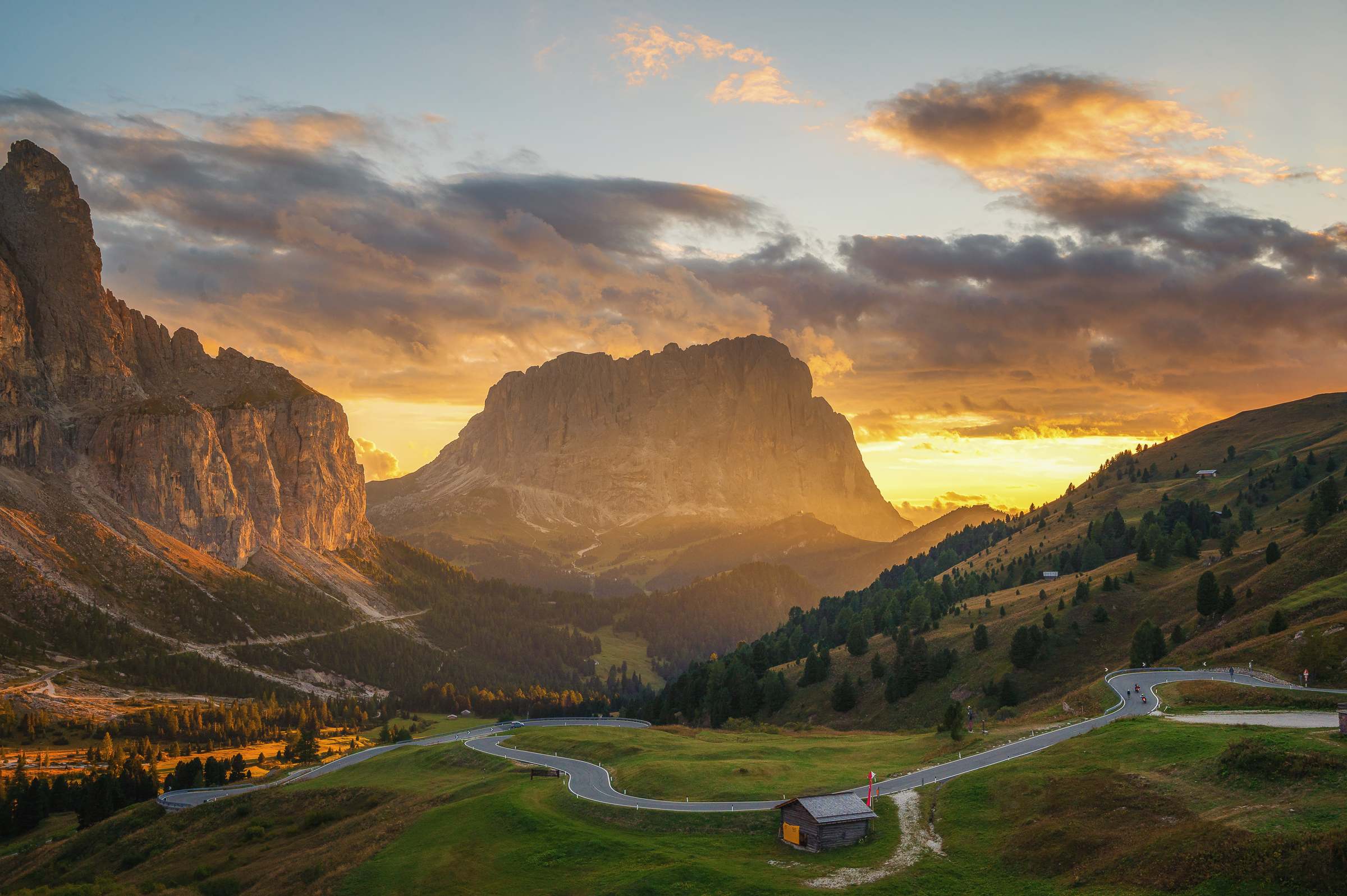 General 2400x1597 nature landscape trees road hairpin turns asphalt mountains sky clouds grass sunlight sunset Dolomites Italy