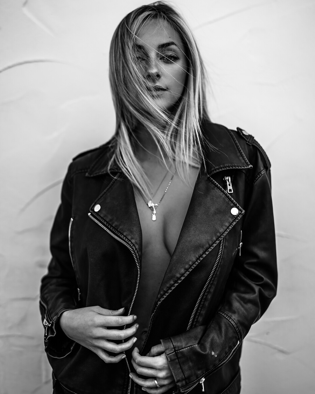 People 1080x1350 women model blonde long hair Cat Kennedy monochrome leather jacket necklace no bra portrait display hair in face belly standing simple background