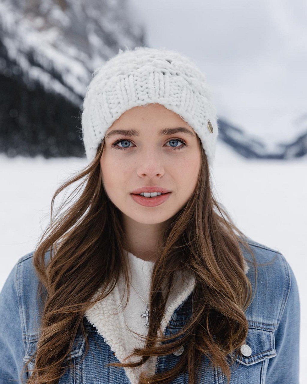 People 1024x1280 model women blue eyes wool cap crucifix necklace open mouth brunette frontal view smiling winter snow looking at viewer women outdoors Caucasian portrait denim jacket young women