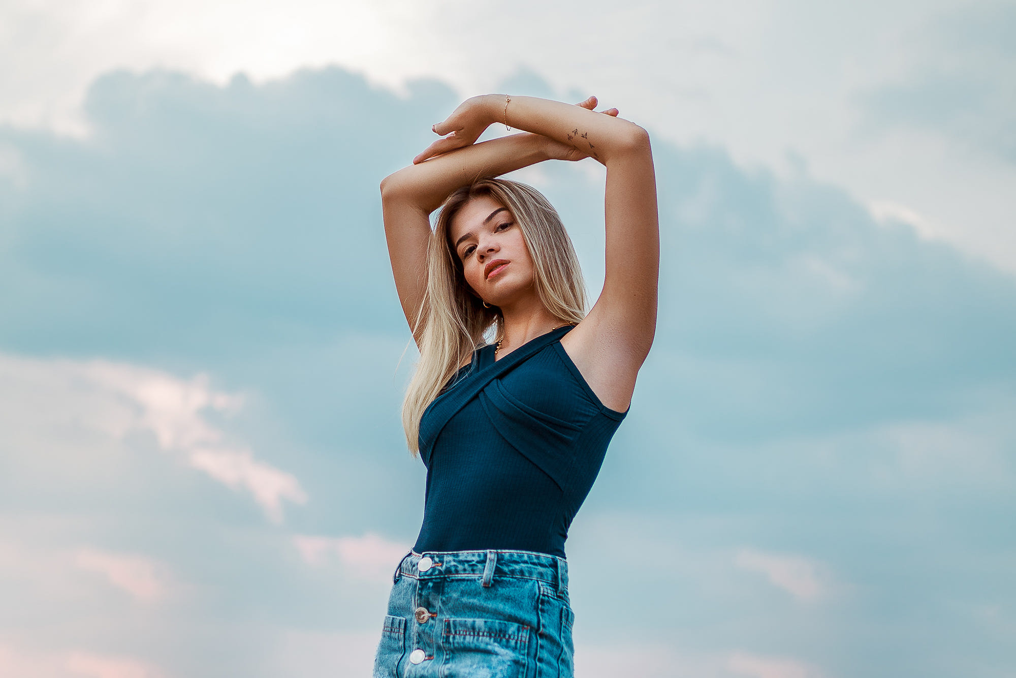 People 2000x1334 women portrait model blonde brown eyes looking at viewer arms up armpits tattoo denim skirt blue tops Edson Brunno