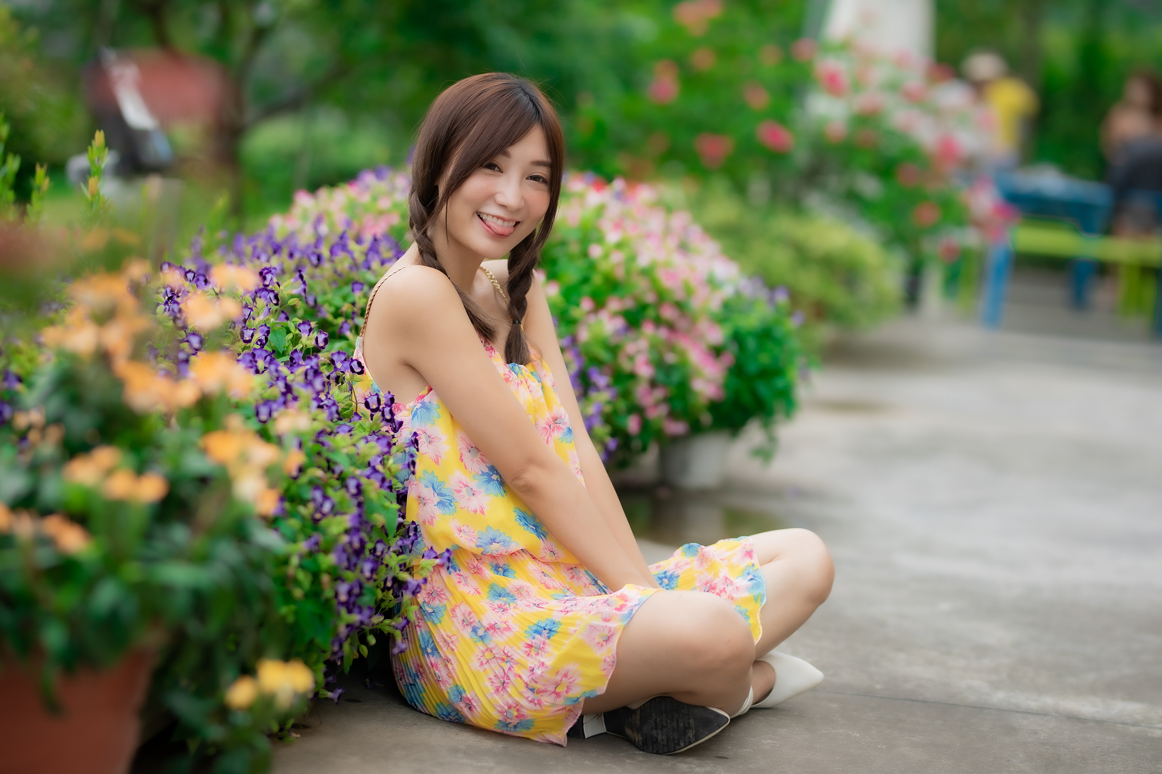 People 3840x2559 Asian model women long hair brunette depth of field twintails flowers flower dress sitting smiling colorful plants tongues tongue out legs crossed dress yellow dress urban