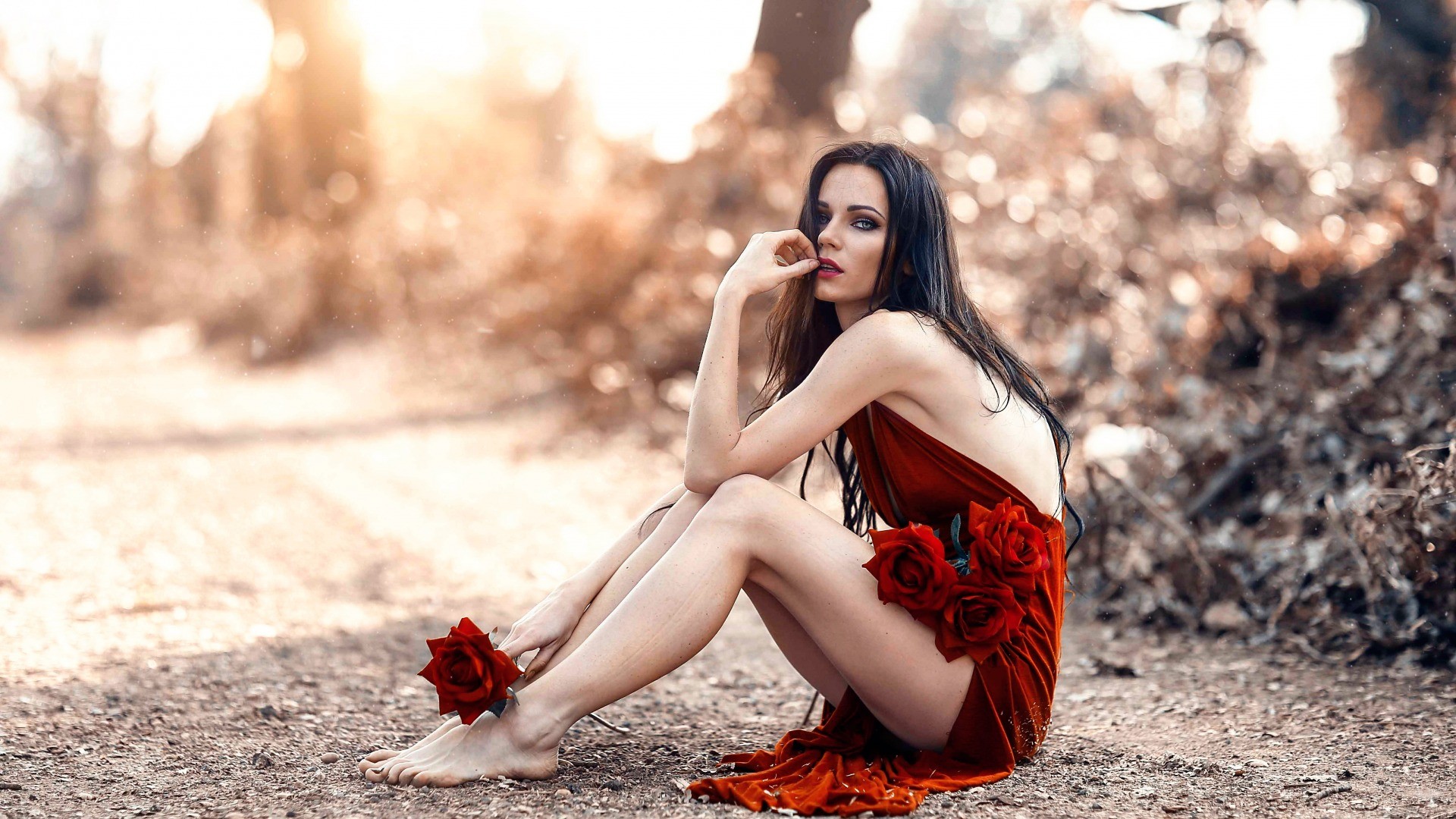 People 1920x1080 Alessandro Di Cicco women long hair looking at viewer depth of field model sitting bare shoulders women outdoors dress legs brunette barefoot straight hair red dress dark hair