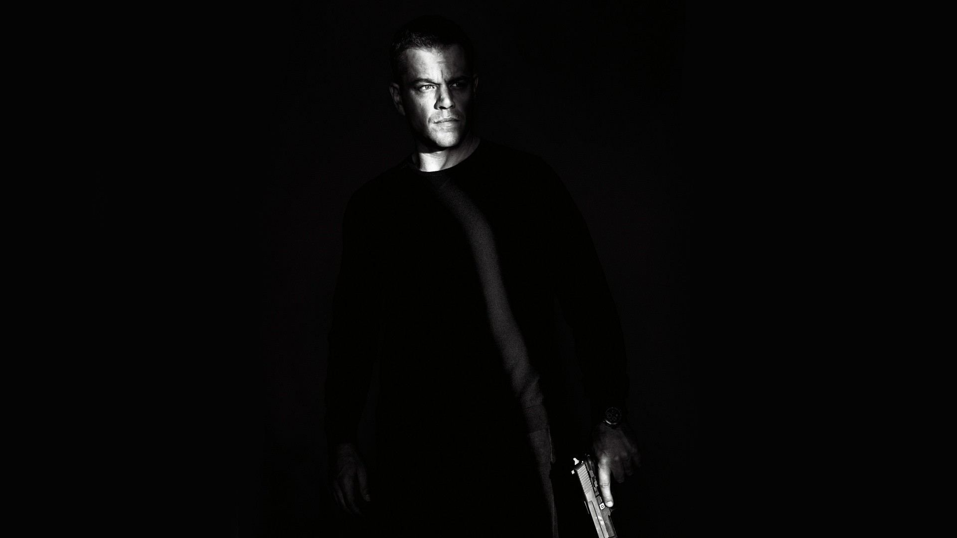People 1920x1080 Matt Damon monochrome The Bourne Legacy gun shadow men weapon movies actor black background