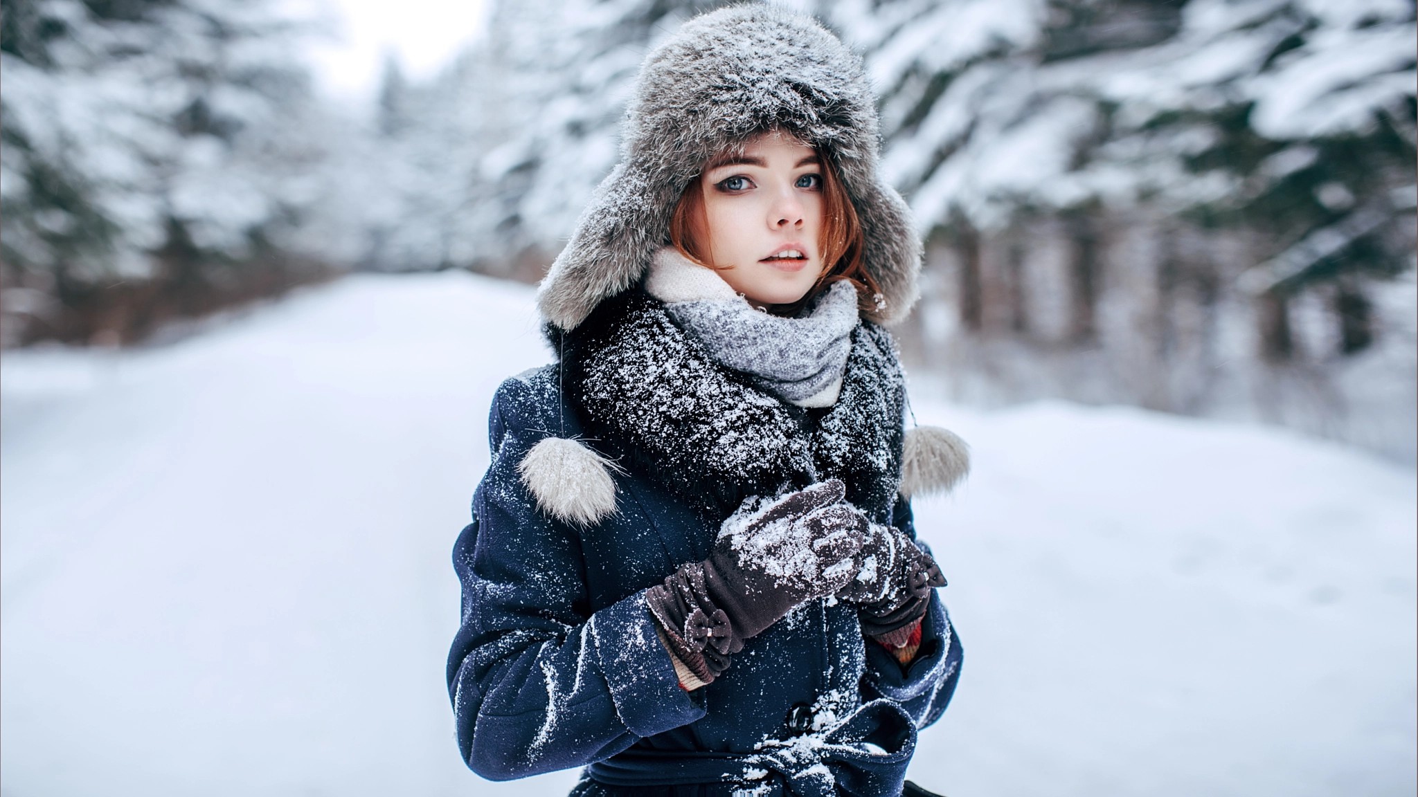 People 2048x1152 portrait women outdoors blue eyes redhead winter snow women looking at viewer depth of field face bokeh photography Andrey Metelkov snow covered teen fur cap