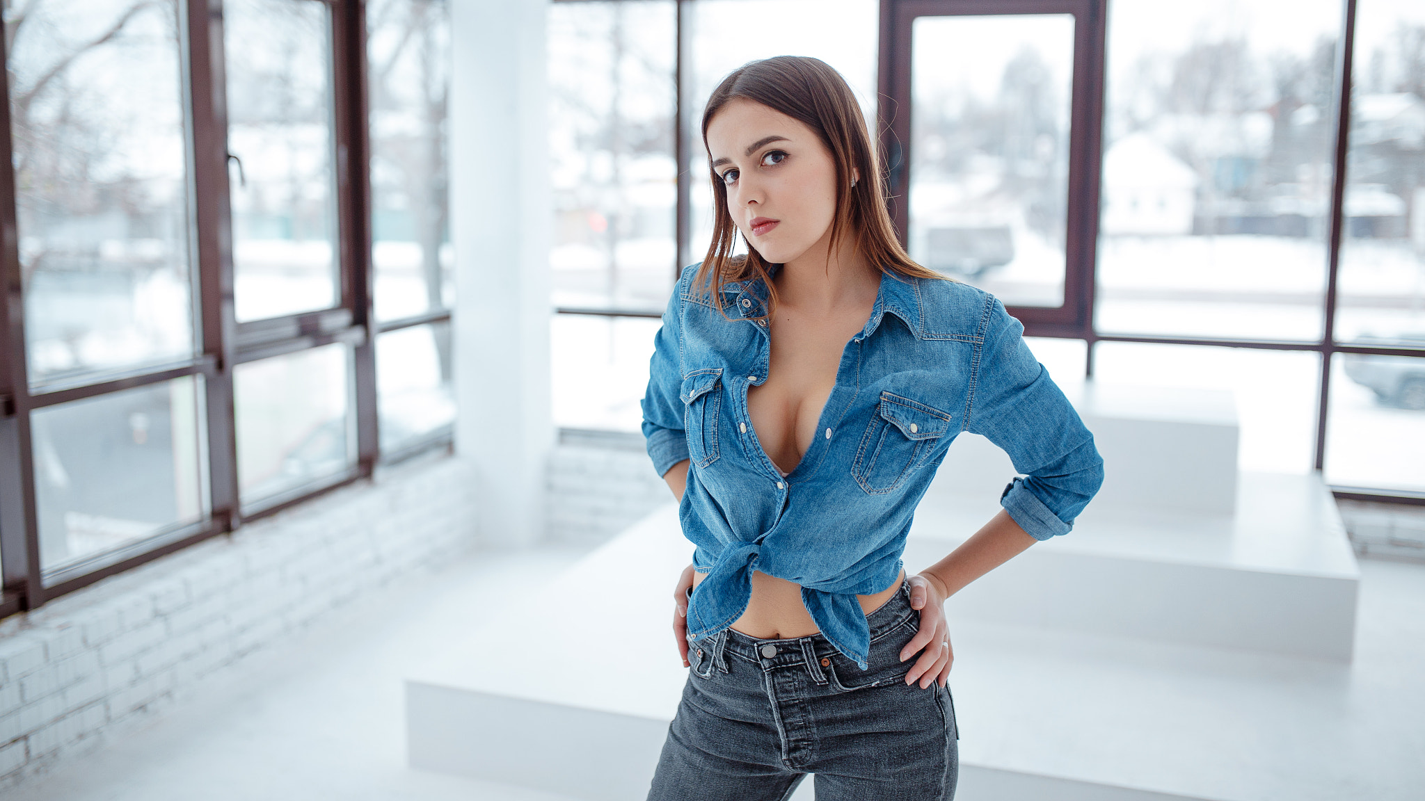 People 2048x1152 women shirt brunette denim shirt hands on hips standing tied top no bra jeans model cleavage women indoors rolled sleeves black pants tight jeans tight pants