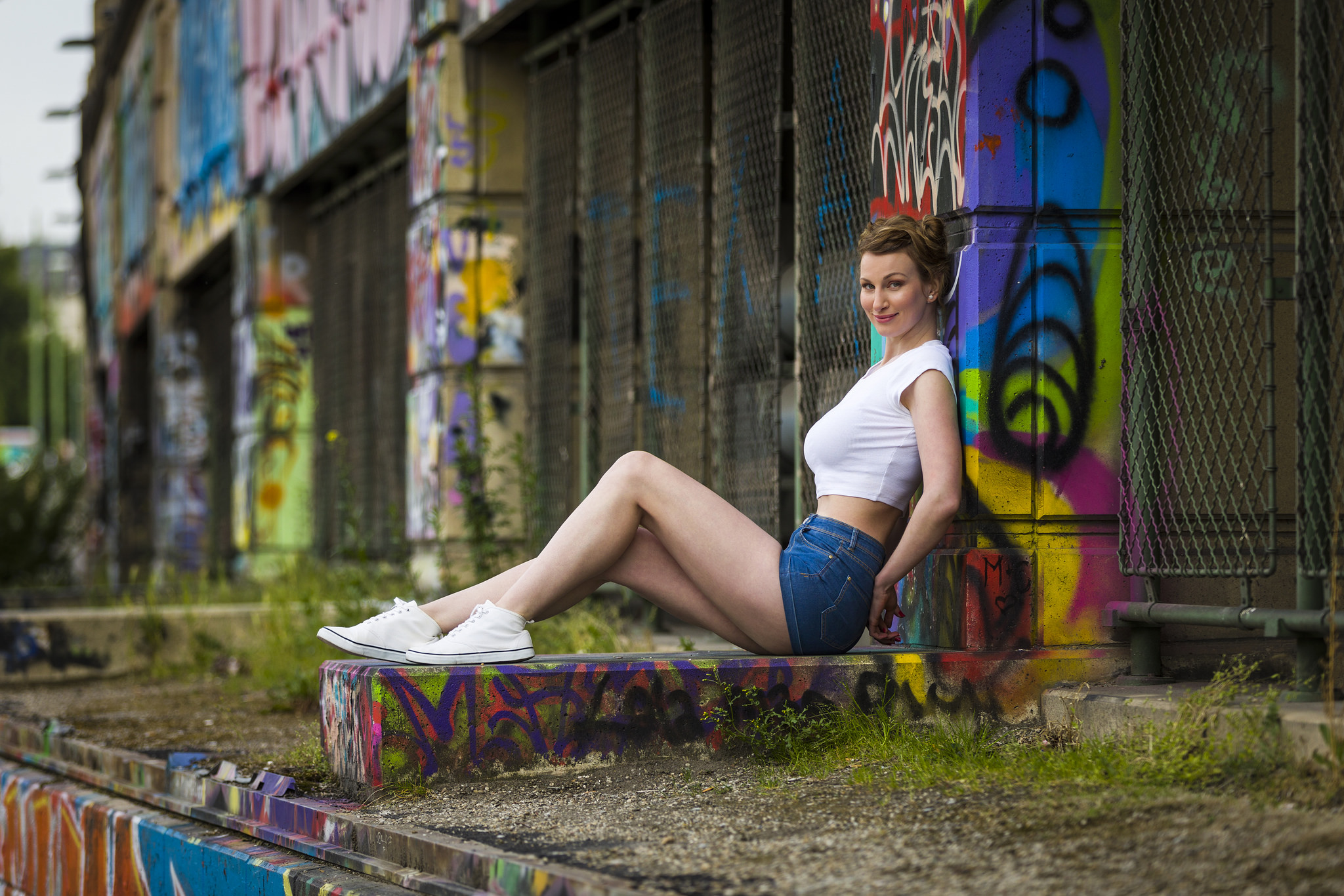 People 2048x1366 women model women outdoors looking at viewer crop top jean shorts sitting Converse graffiti painted nails