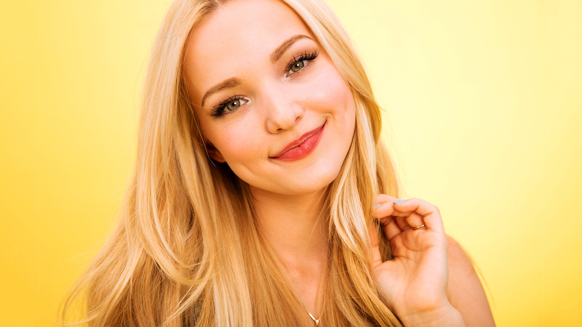 People 1920x1080 Dove Cameron smiling blonde long hair portrait yellow background women looking at viewer face closeup makeup simple background women indoors indoors
