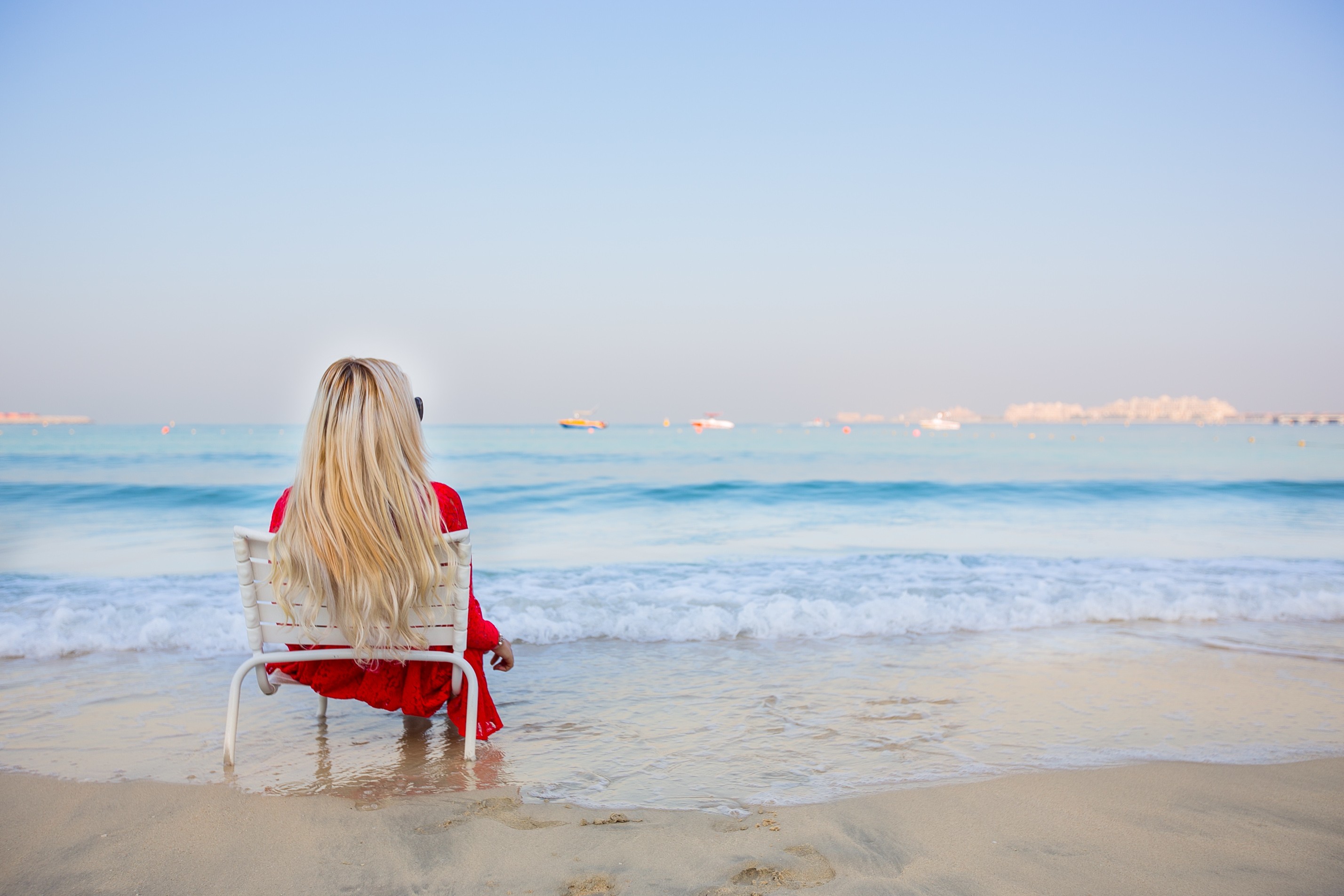 People 2856x1904 blonde beach women sea sitting chair long hair women outdoors women on beach sky model