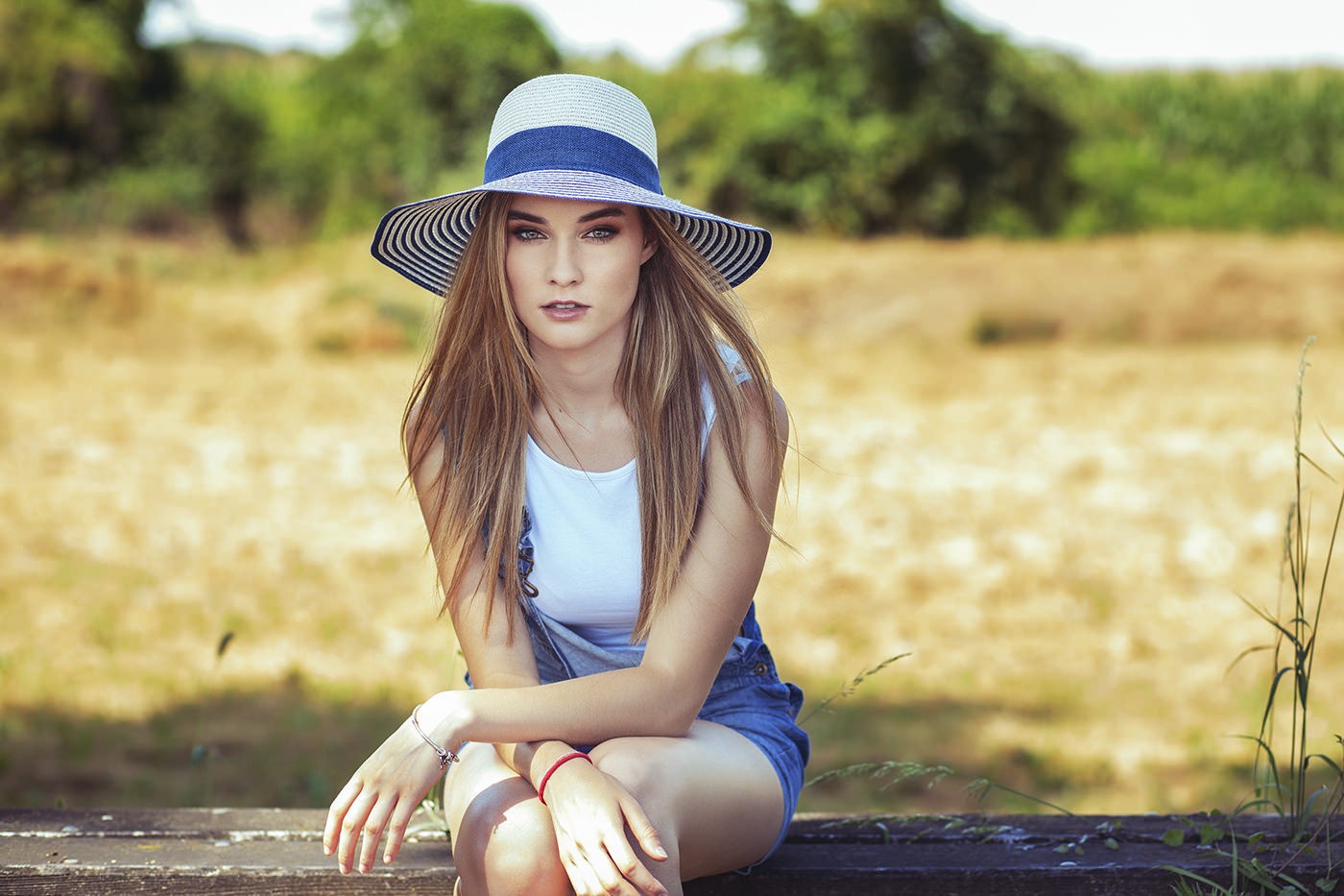 People 1400x933 women sitting hat overalls women outdoors blonde looking at viewer millinery long hair straight hair women with hats model celebrity white tops jeans outdoors
