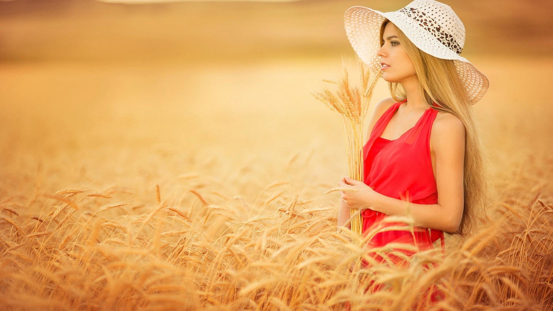 People 1920x1080 women blonde hat women outdoors wheat farm plants red dress long hair dress Agro (Plants) face profile women with hats field red clothing