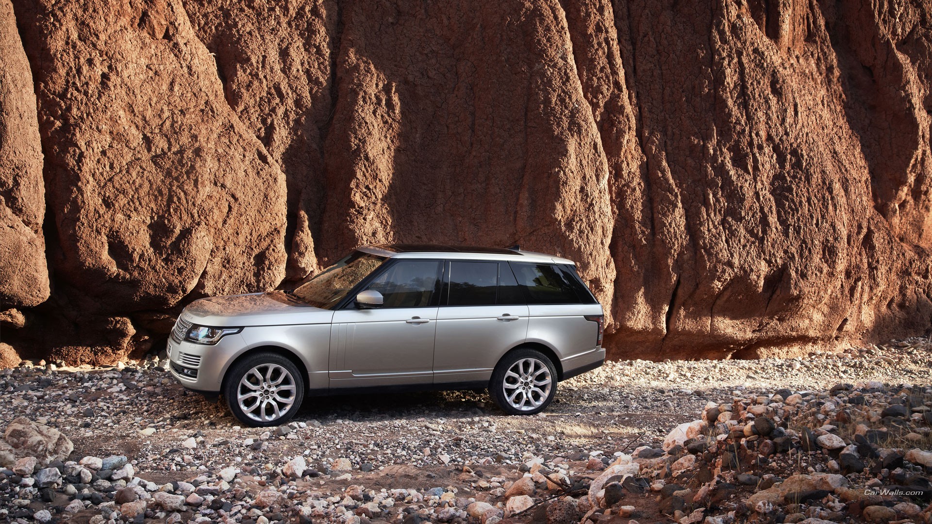 General 1920x1080 Range Rover car vehicle silver cars rocks outdoors Land Rover watermarked British cars SUV