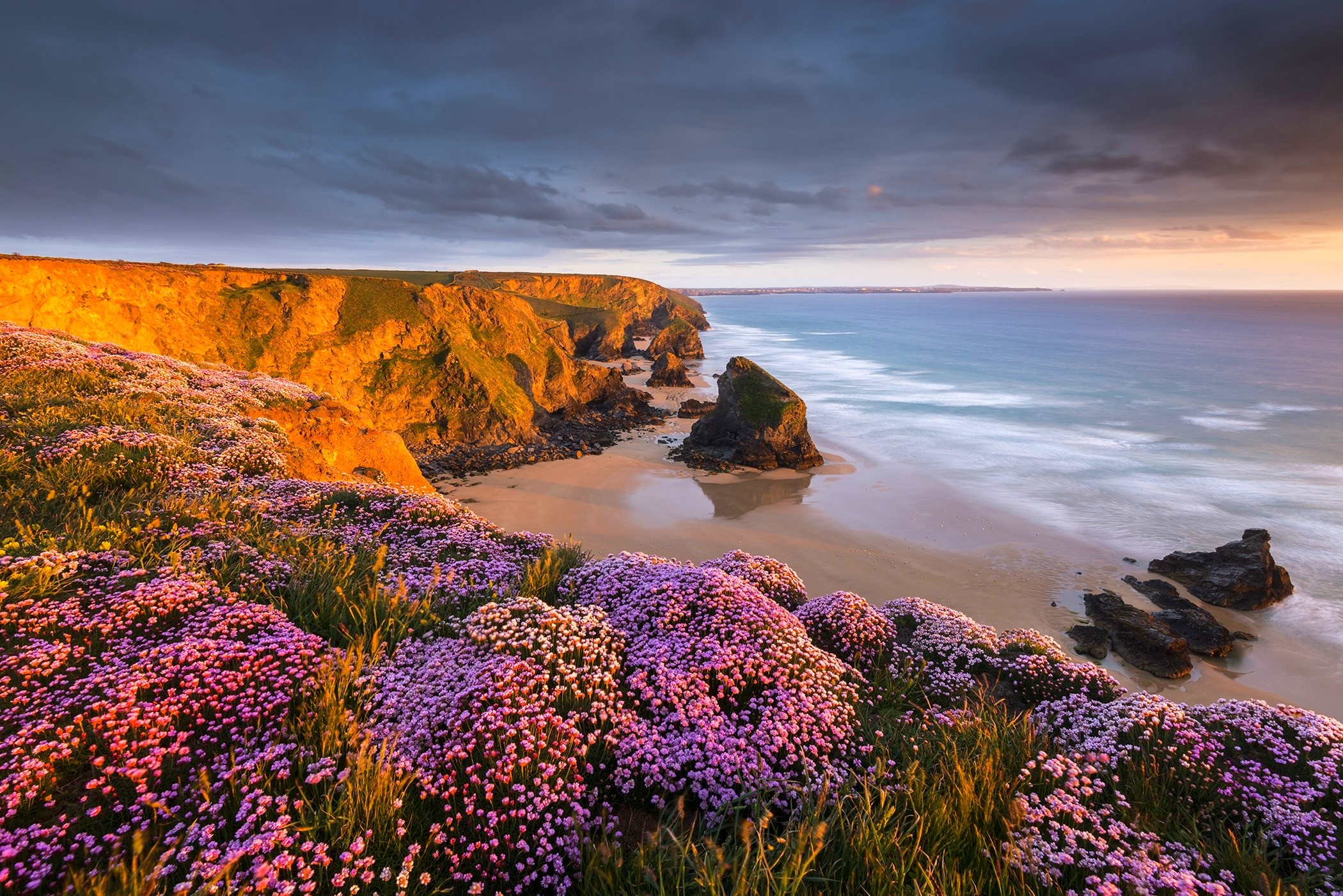 General 2100x1402 coast beach flowers sunset sand sea cliff clouds rocks nature landscape