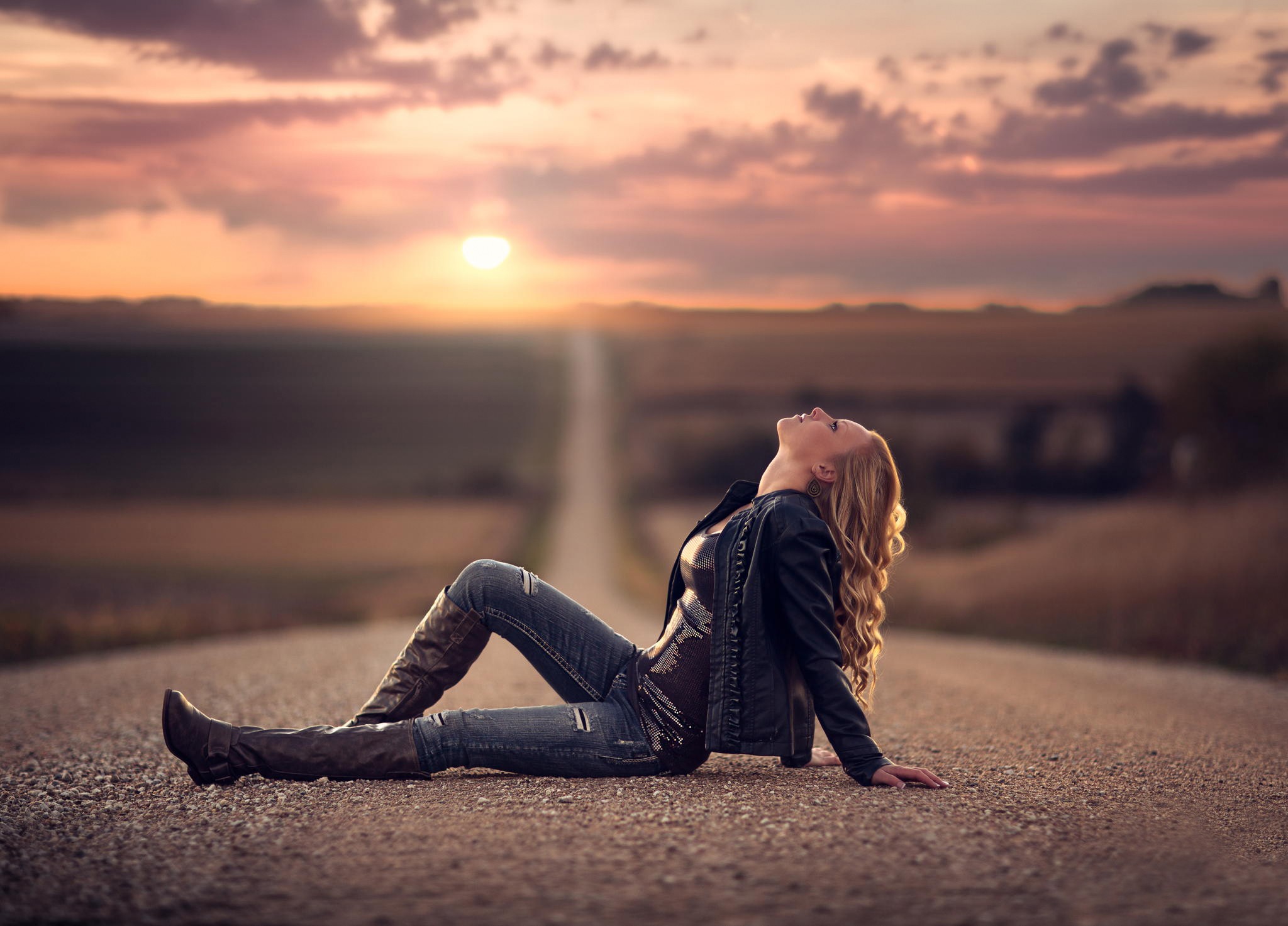 People 2048x1473 women road landscape Jake Olson looking up curly hair blonde jeans depth of field black jackets knee-high boots torn jeans sky dirt road long hair sitting women outdoors outdoors