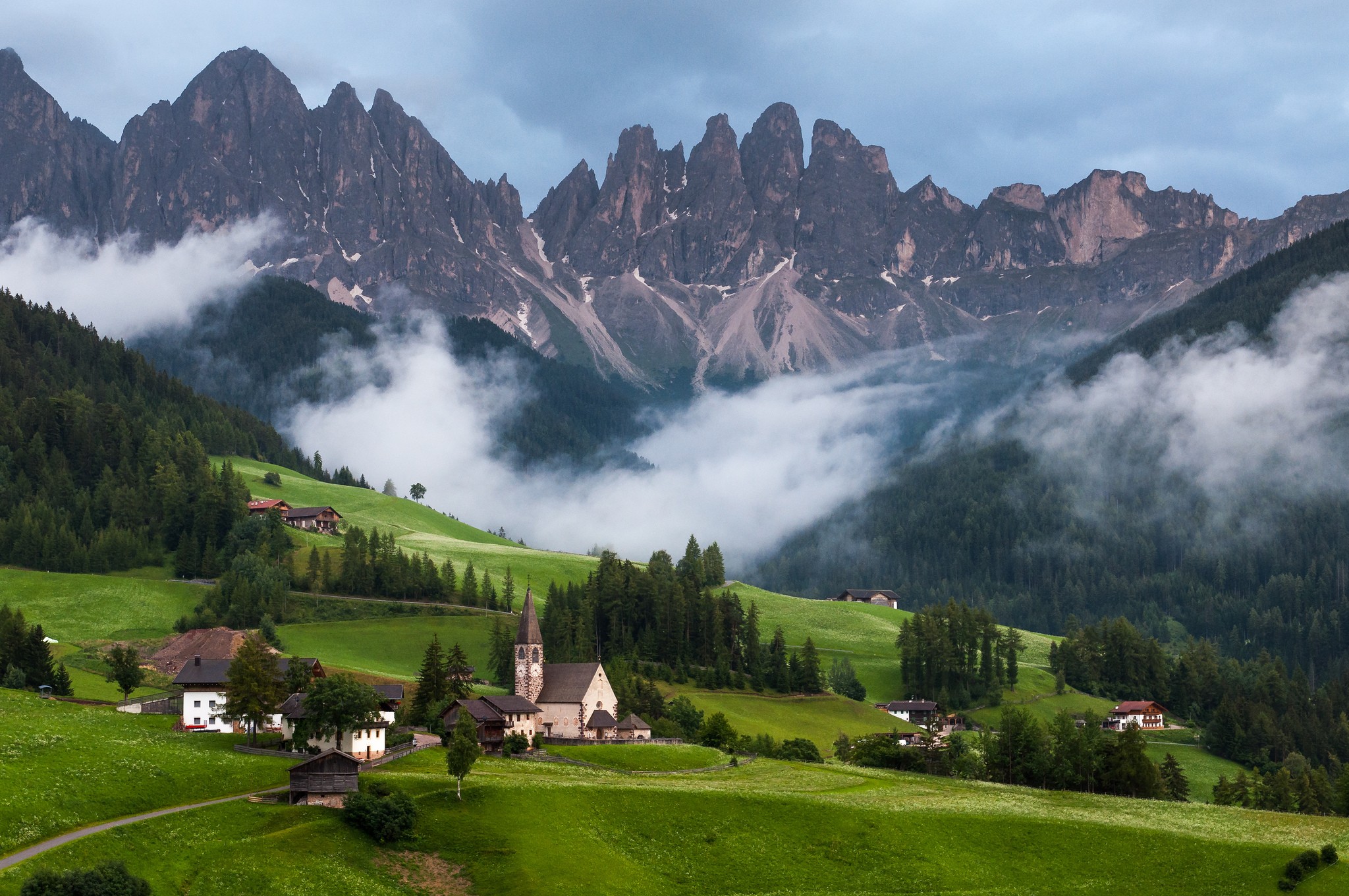 General 2048x1360 nature landscape mountains clouds trees Italy Dolomites mist forest church hills house field Santa Magdalena
