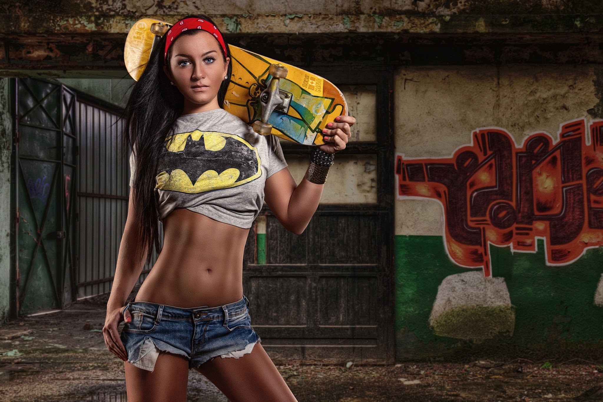 People 2048x1366 women jean shorts skateboard innie navel crop top belly button belly bare midriff Batman T-Shirt black hair standing tanned looking at viewer urban hairband