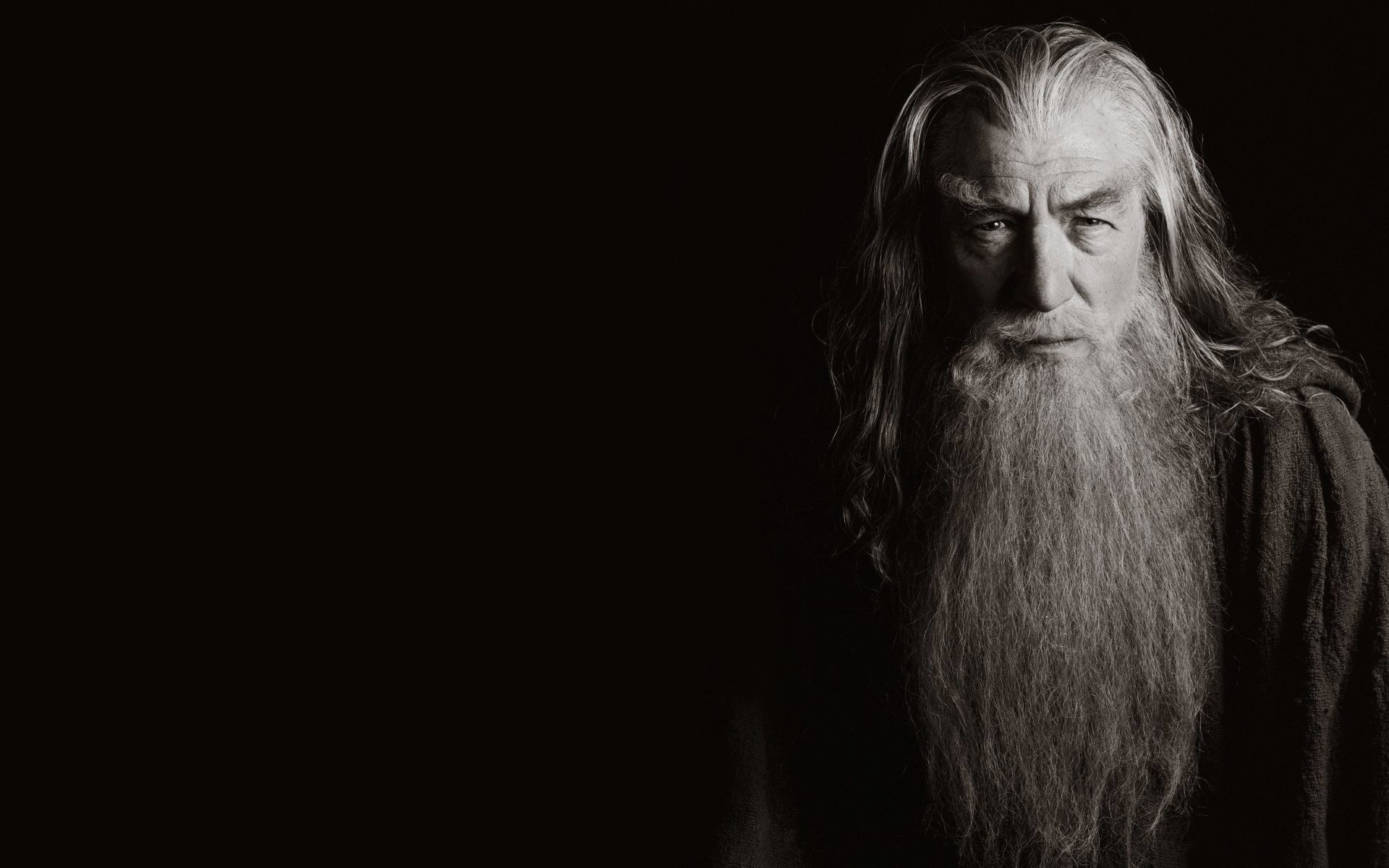 General 1920x1200 Gandalf The Lord of the Rings movies Ian McKellen sepia dark background simple background monochrome wizard actor beard looking at viewer Book characters
