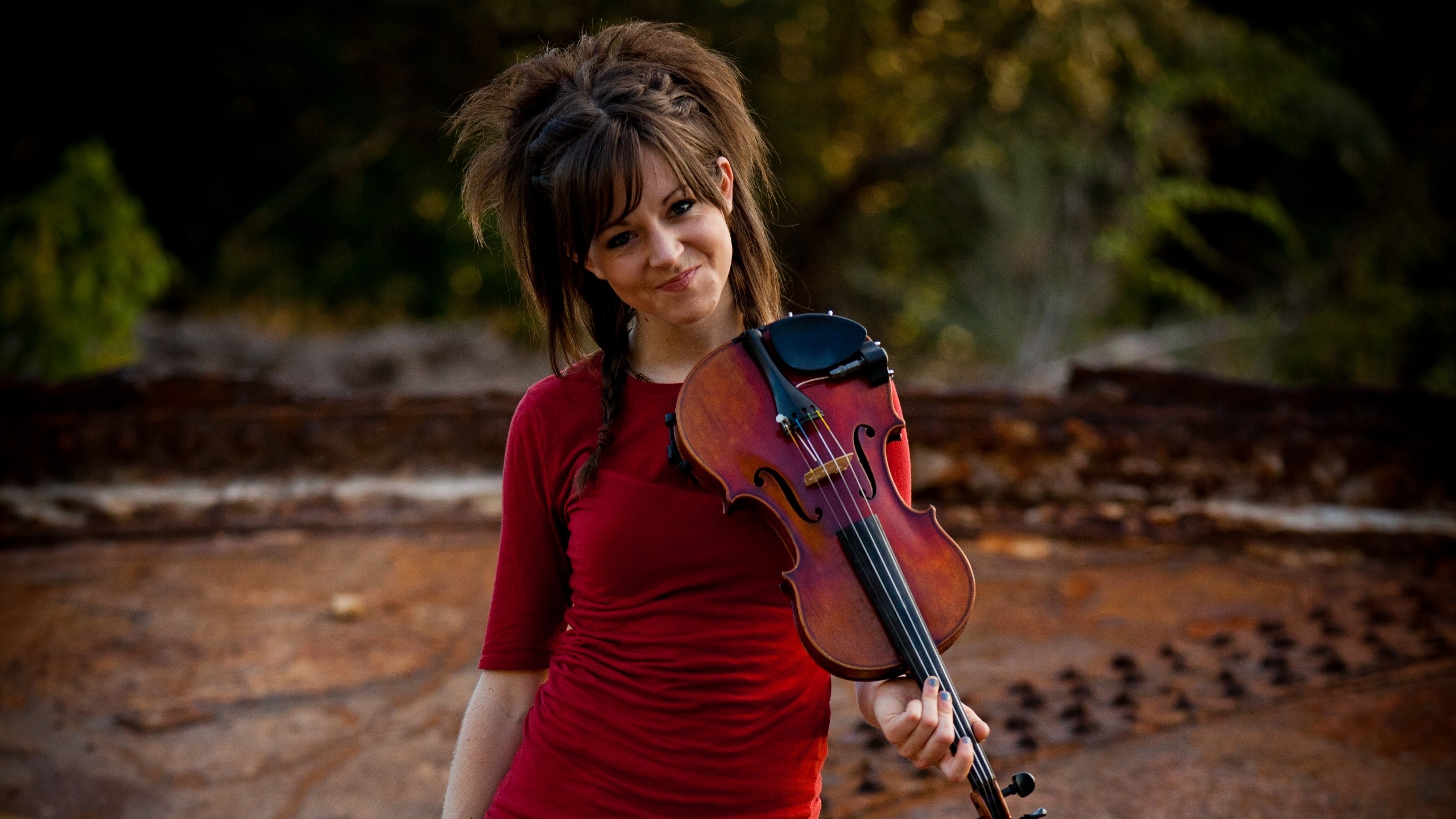 People 2560x1440 Lindsey Stirling red clothing violin women musician musical instrument looking at viewer celebrity women outdoors