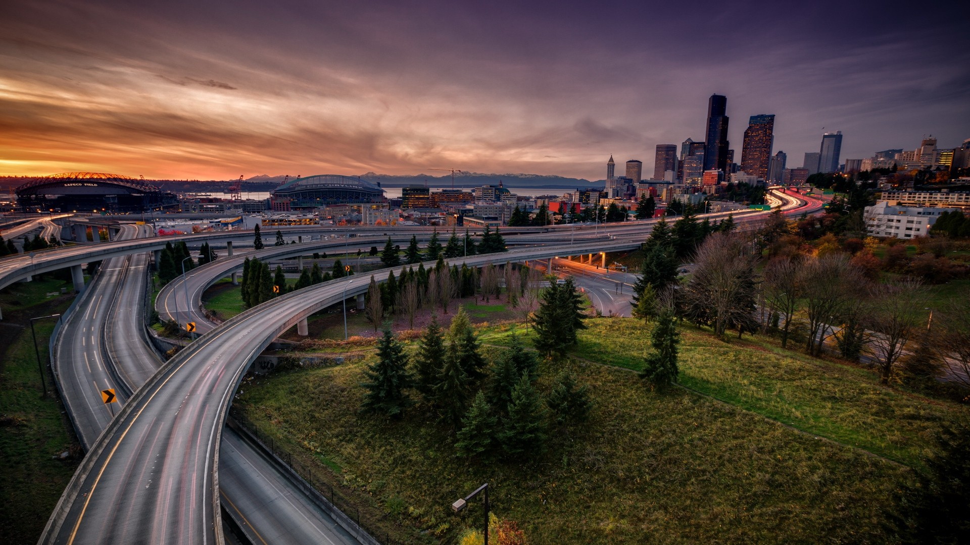 General 1920x1080 cityscape architecture road building skyscraper clouds highway trees evening sunset grass street light trails long exposure cranes (machine) stadium Seattle USA interchange overpass Washington State intersections