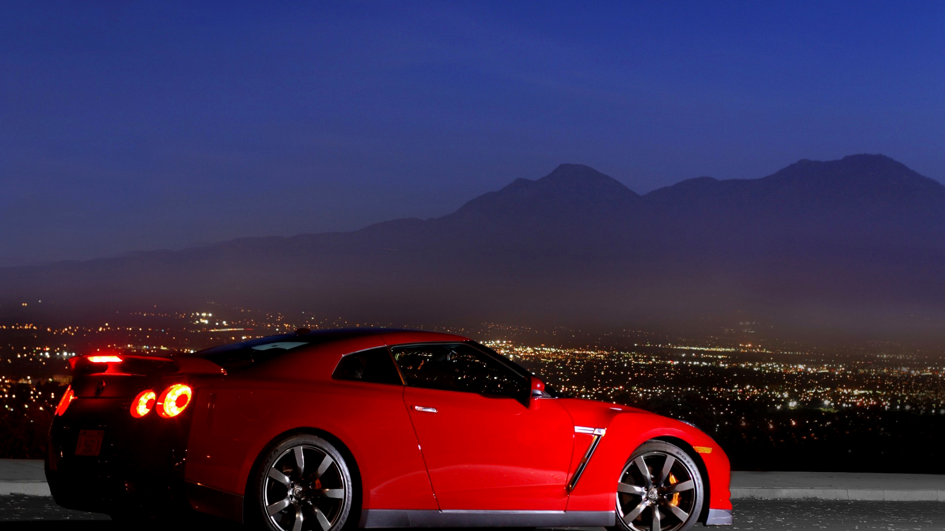 General 1920x1080 car red cars lights mountains Nissan road city vehicle Nissan GT-R Japanese cars