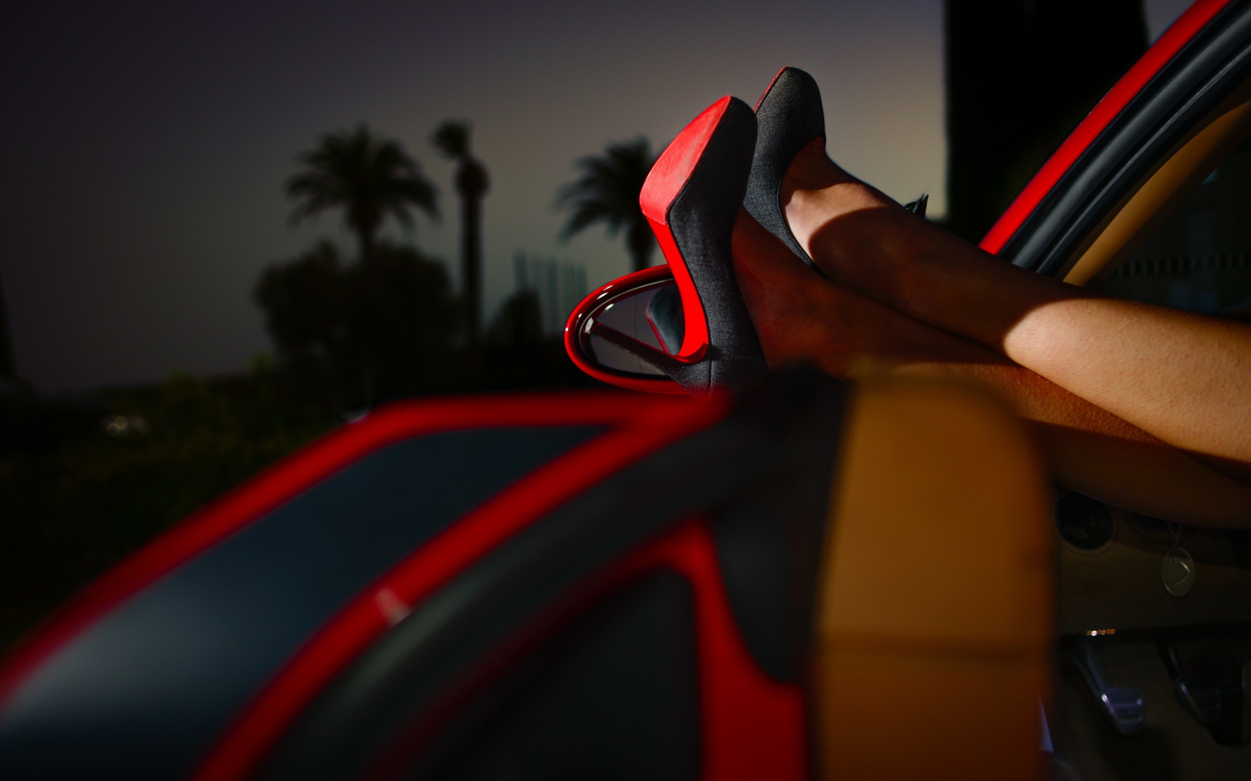 People 2560x1600 women model legs high heels stiletto car car interior black heels palm trees evening depth of field Louboutin heels women with cars vehicle red cars