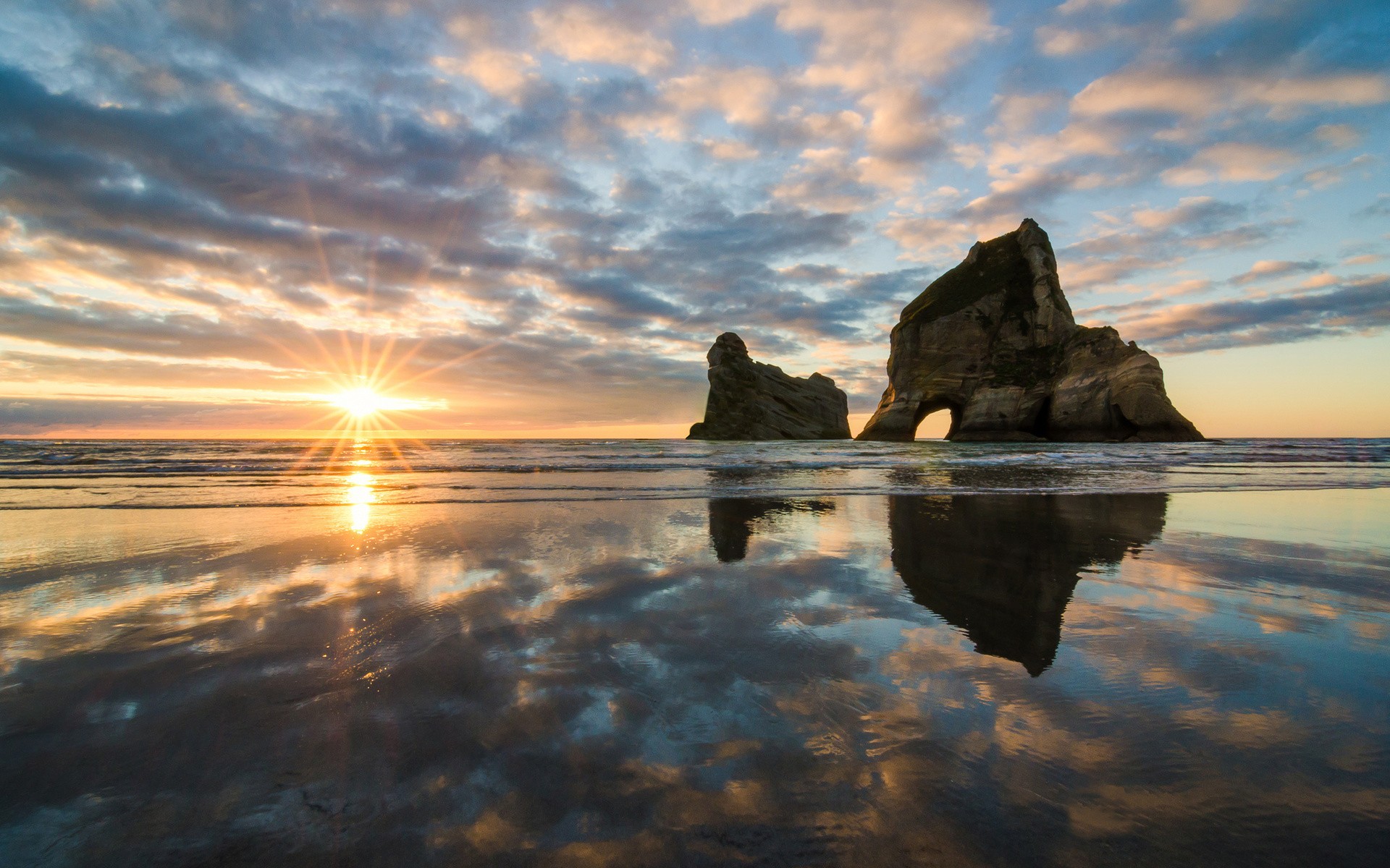 General 1920x1200 nature landscape lens flare sunset clouds reflection water rocks rock formation waves beach coast New Zealand