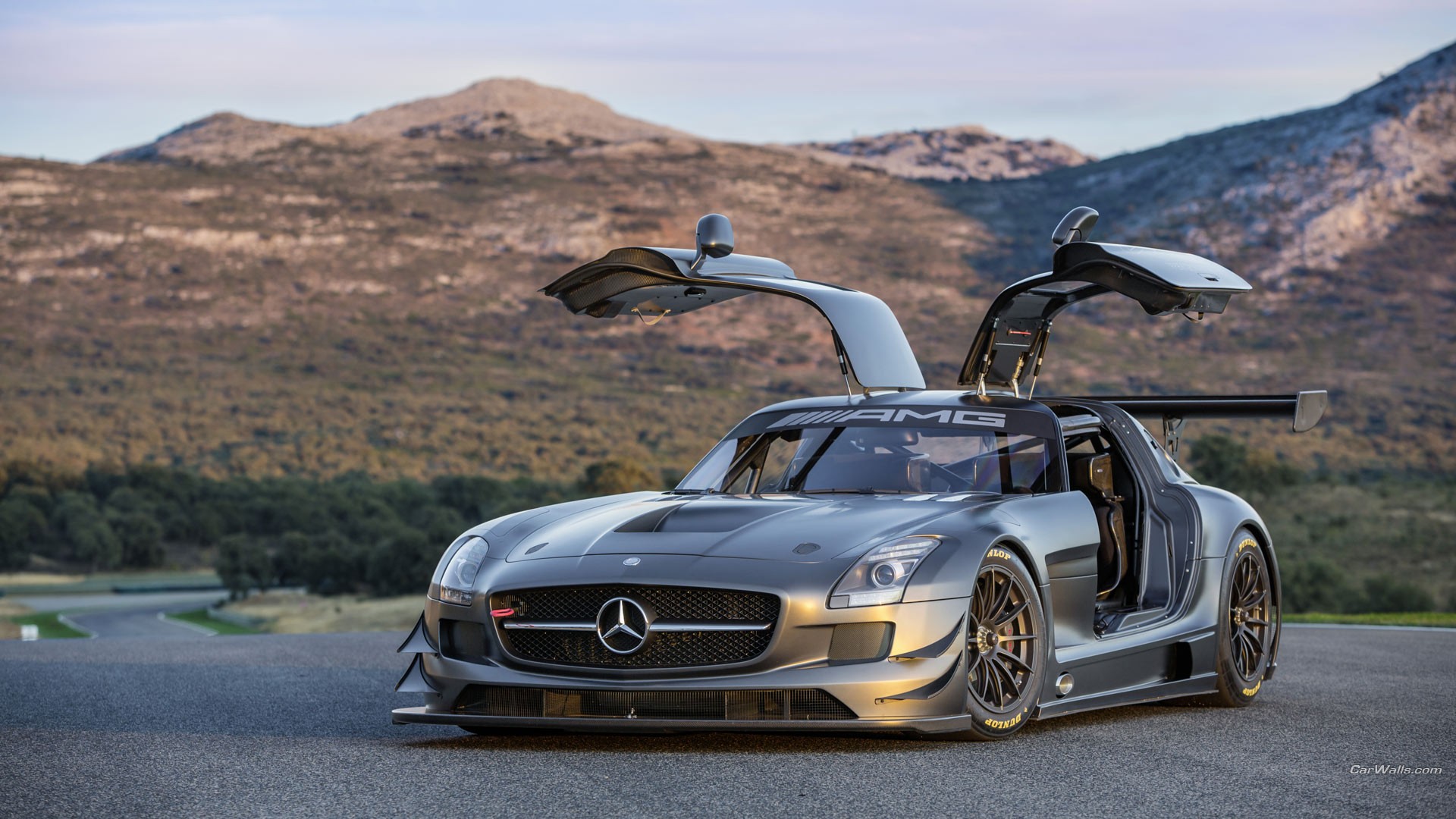 General 1920x1080 Mercedes-Benz SLS AMG German cars race cars coupe Mercedes-Benz car spoiler Grand Tour car watermarked frontal view sunlight