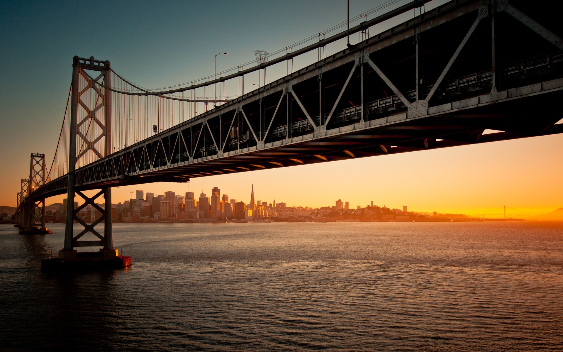 General 1920x1200 cityscape San Francisco Oakland Bay Bridge sunset bridge suspension bridge USA sunlight water California