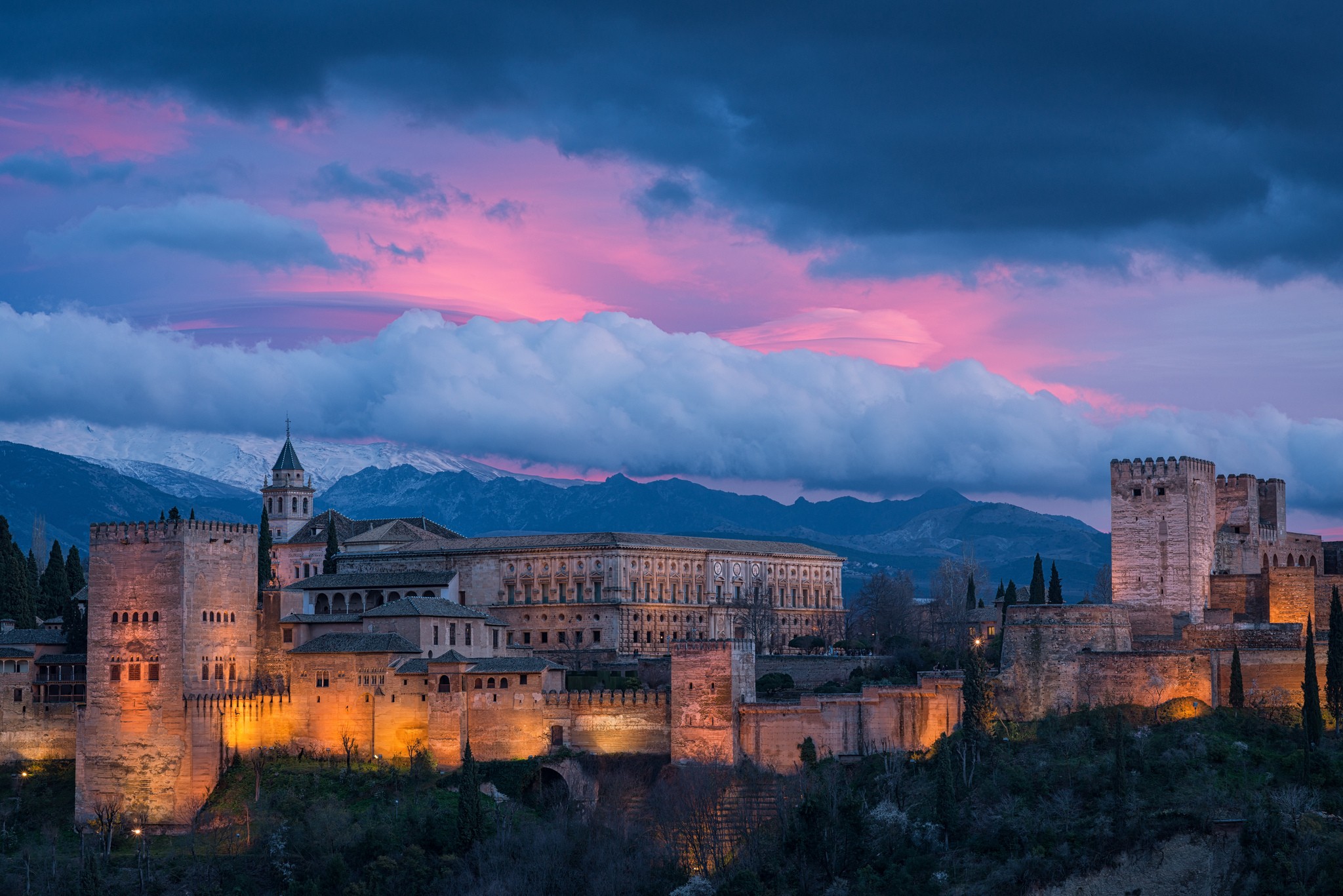 General 2048x1367 landscape castle clouds hills trees Spain sunset mountains old building lights La Alhambra Granada Andalusia