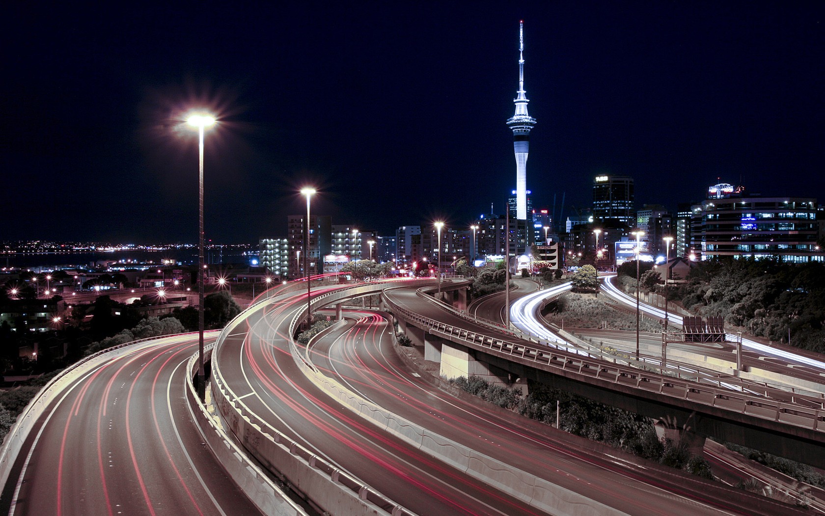 General 1680x1050 highway night cityscape long exposure New Zealand city lights light trails