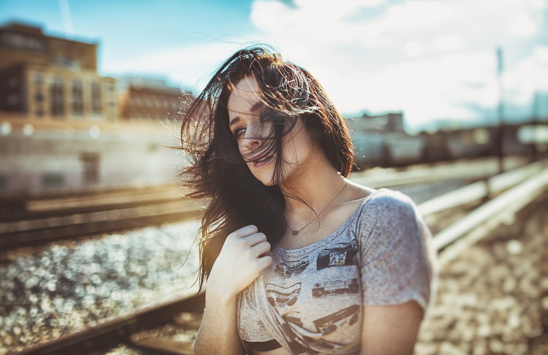 People 1920x1246 urban women portrait model T-shirt hair in face looking into the distance railway