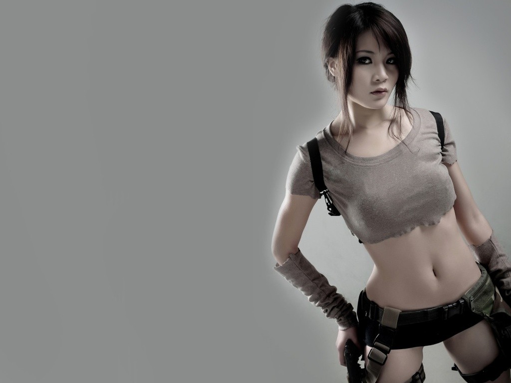 People 1024x768 Asian cosplay brunette women Lara Croft (Tomb Raider) Tomb Raider belly model women indoors indoors video game girls video game characters gray background