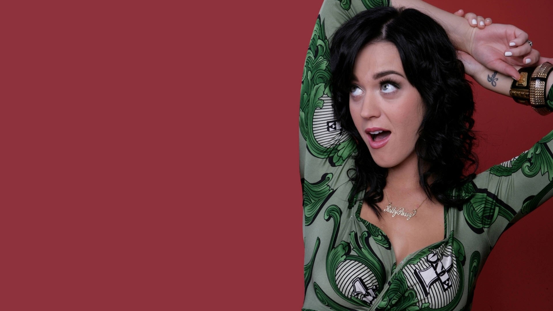 People 1920x1080 Katy Perry singer women green dress arms up celebrity red background simple background black hair looking up open mouth necklace bracelets shoulder length hair