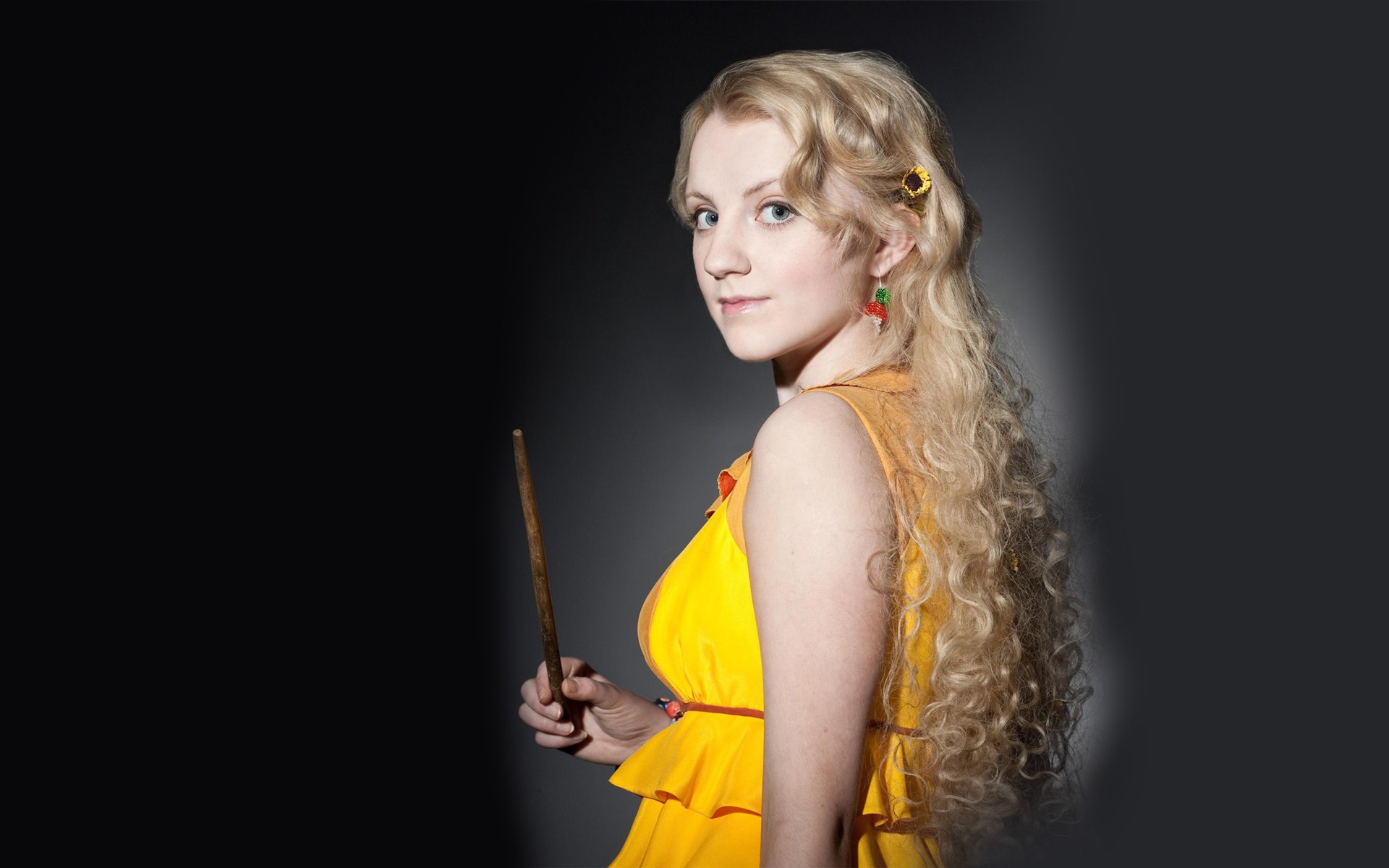 People 1920x1200 Evanna Lynch yellow dress Harry Potter Luna Lovegood looking back blonde women actress curly hair long hair gray eyes studio hair extensions simple background black background