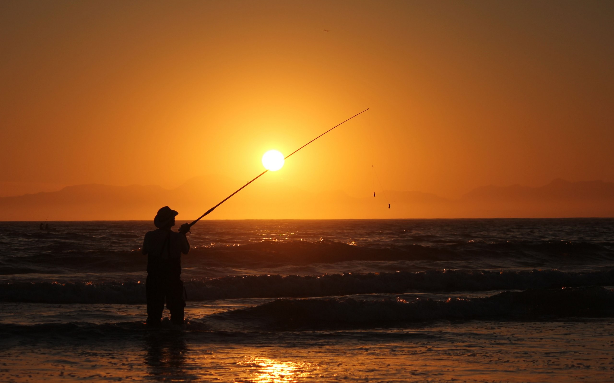 General 2560x1600 photography nature water beach sea sunset fisherman orange sky sky fishing rod horizon low light