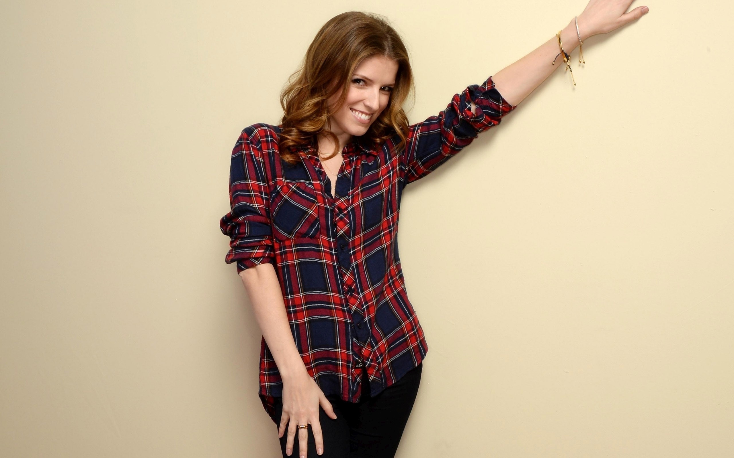 People 2560x1600 Anna Kendrick actress celebrity women simple background brunette plaid shirt one arm up shirt hand on leg American women studio beige background looking at viewer