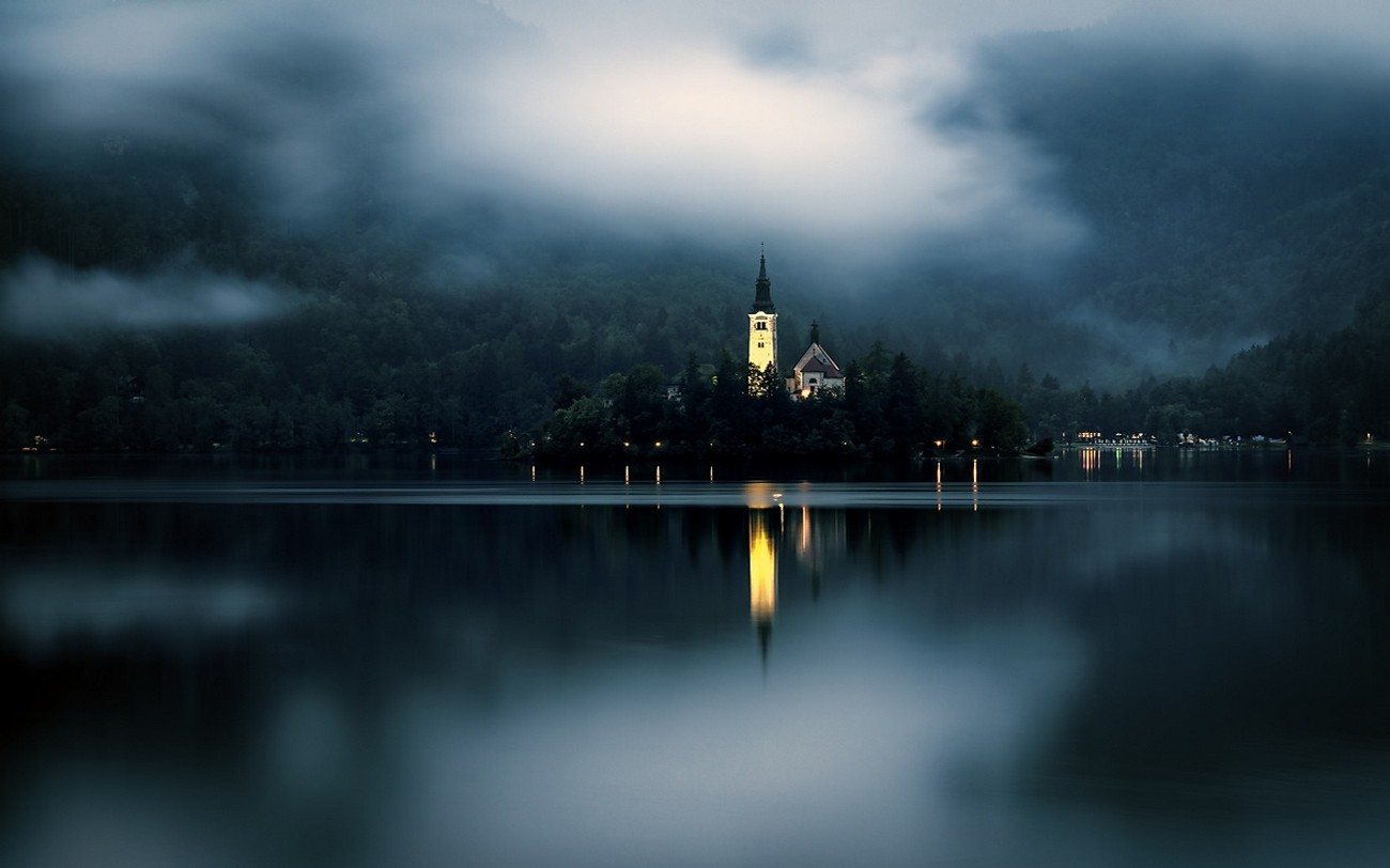 General 1300x812 nature landscape mist lake mountains forest island church lights Slovenia Lake Bled
