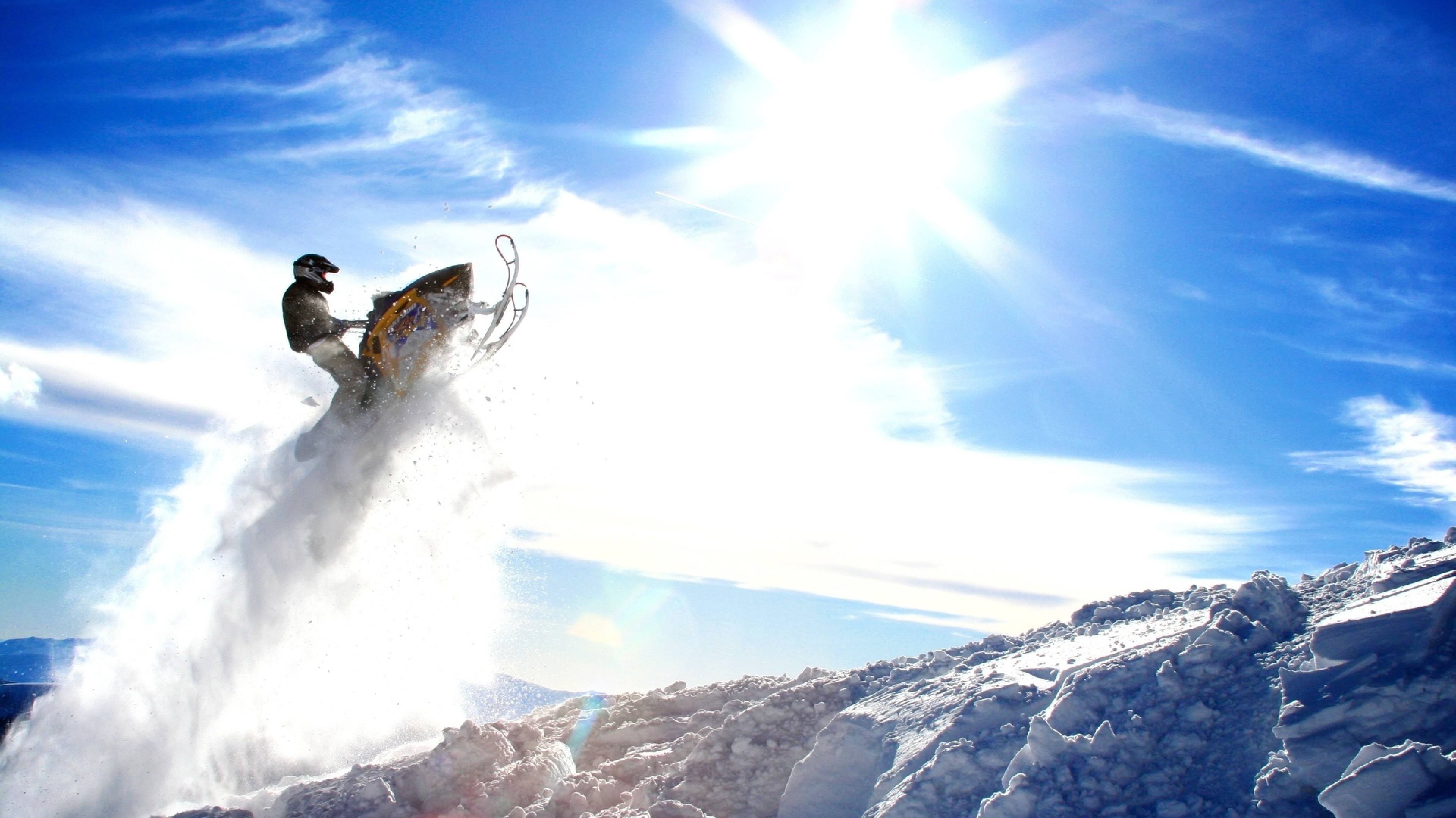 General 3840x2160 snowmobile mountains snow jumping sky
