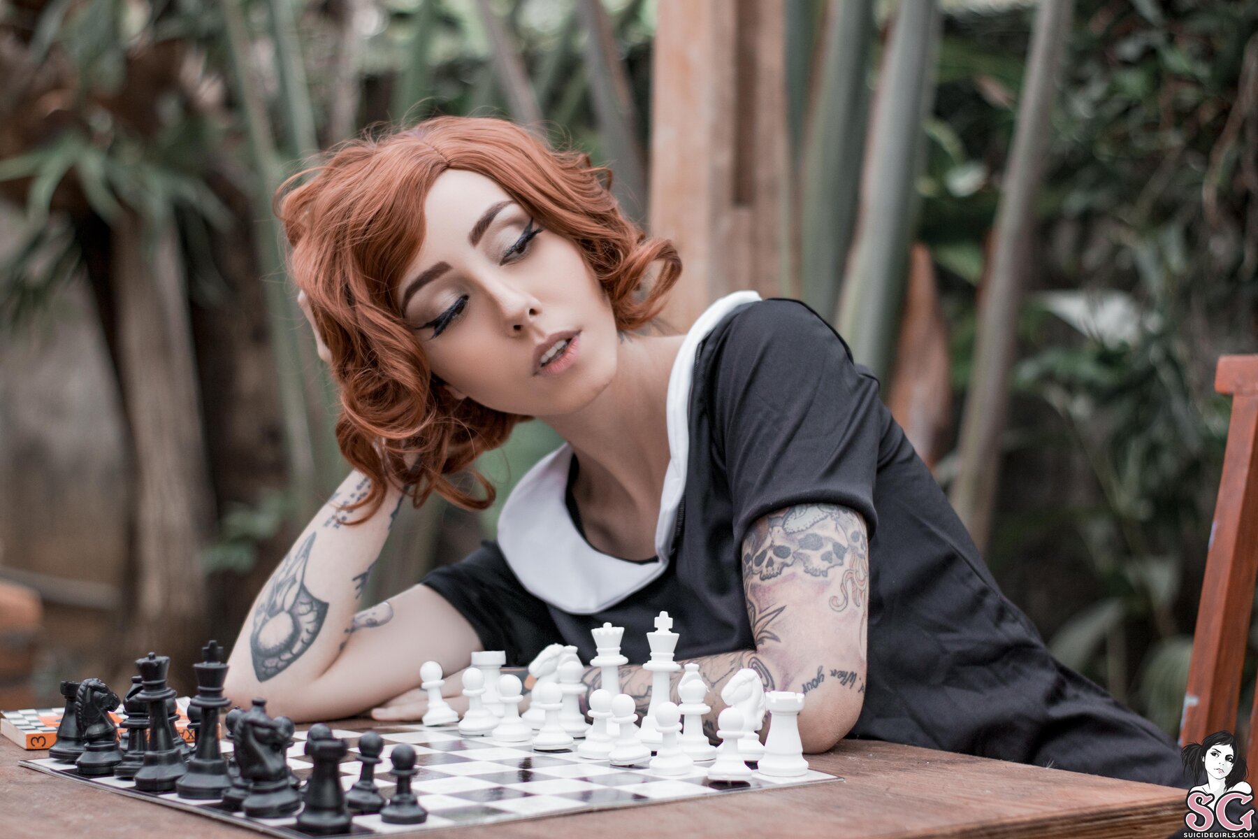 People 1800x1200 Suicide Girls redhead cosplay photography model looking sideways looking away table hand(s) on head women open mouth tattoo tattoo sleeve chess short hair Beth Harmon depth of field outdoors women outdoors sitting The Queen's Gambit Evelyn Oliveira