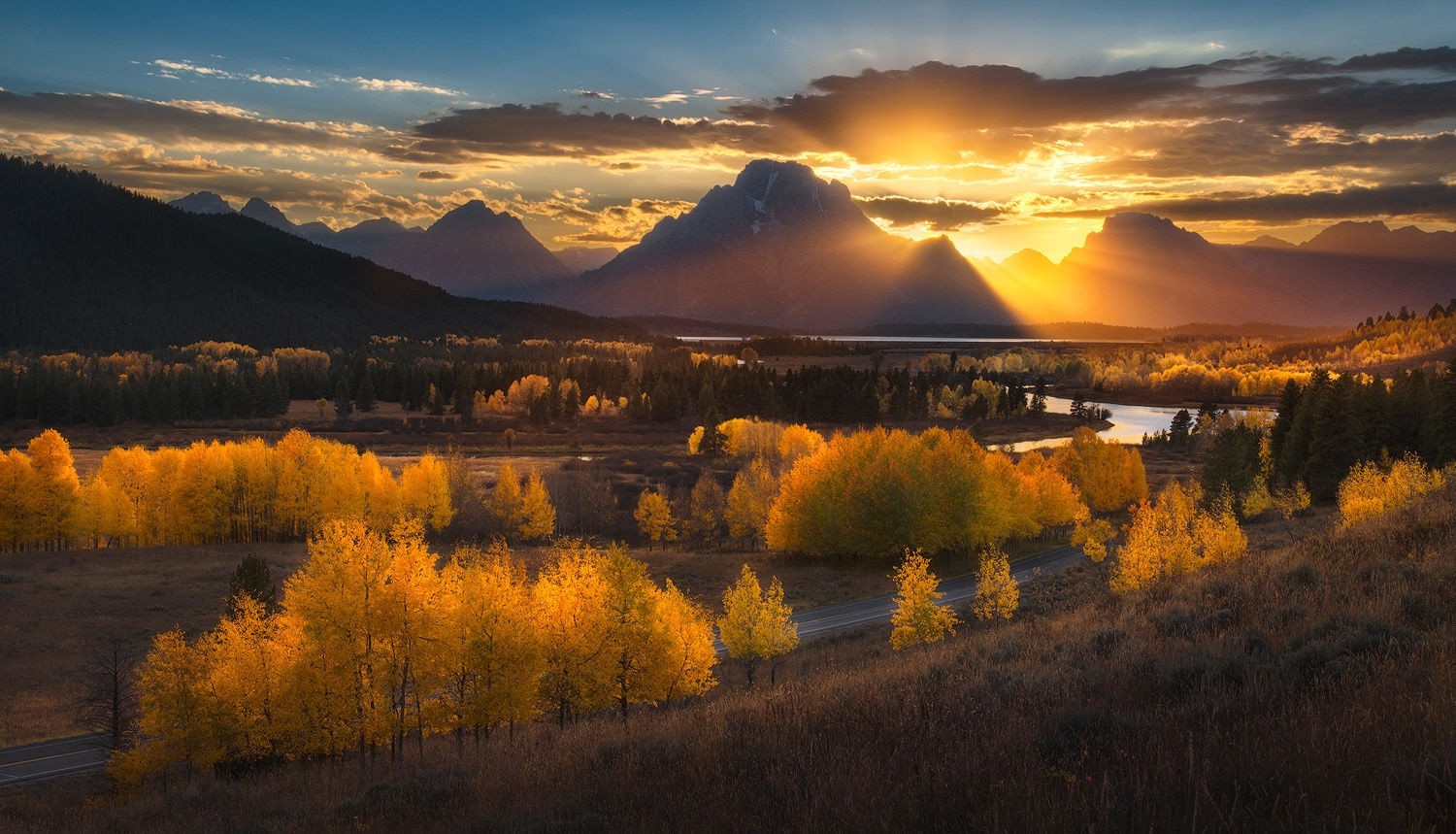 General 1500x859 nature photography landscape sunset mountains sun rays forest river fall road dry grass trees clouds Grand Teton National Park Wyoming