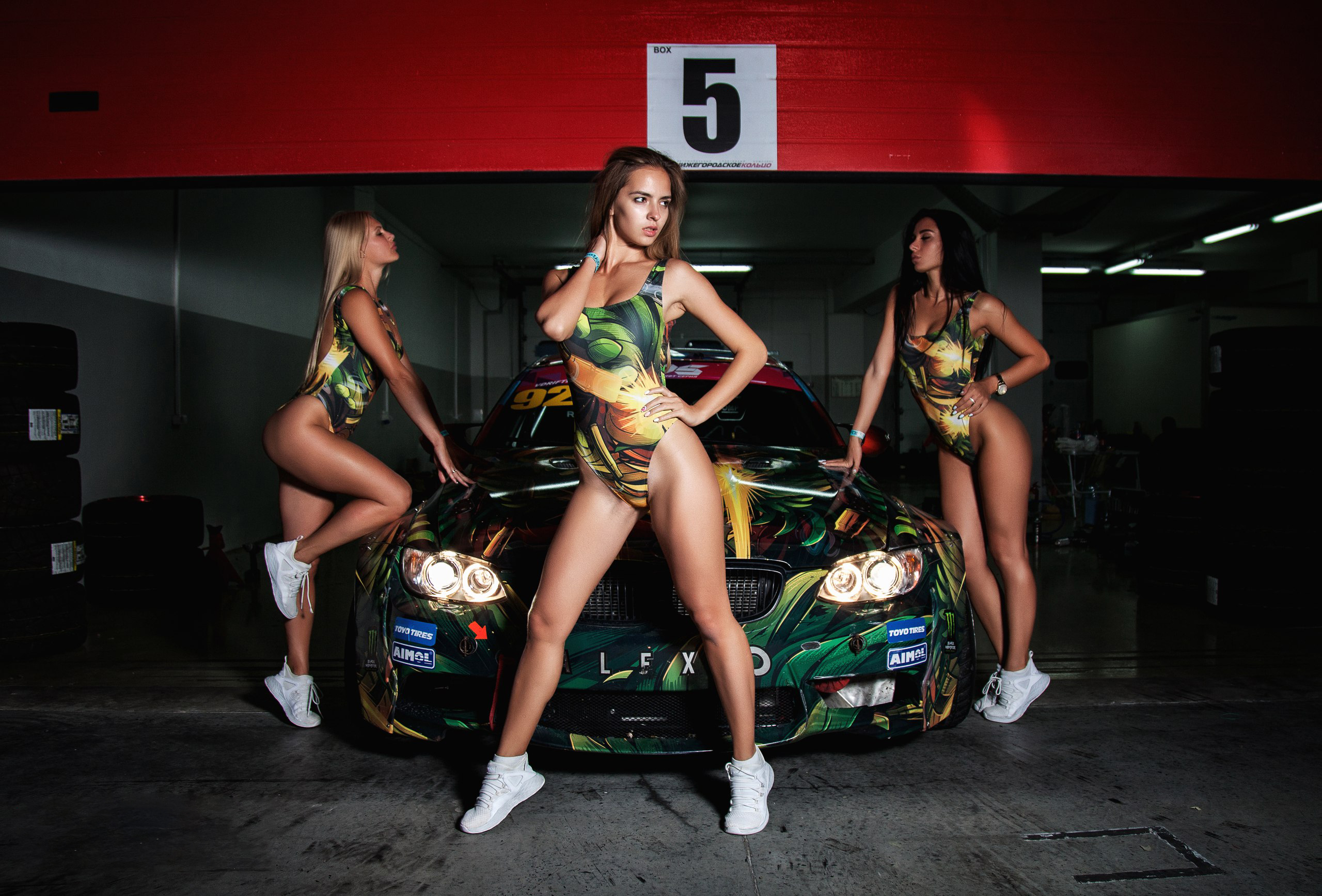 People 2560x1735 women sneakers tanned ass one-piece swimsuit blonde car closed eyes garage black hair group of women monokinis looking away women with cars